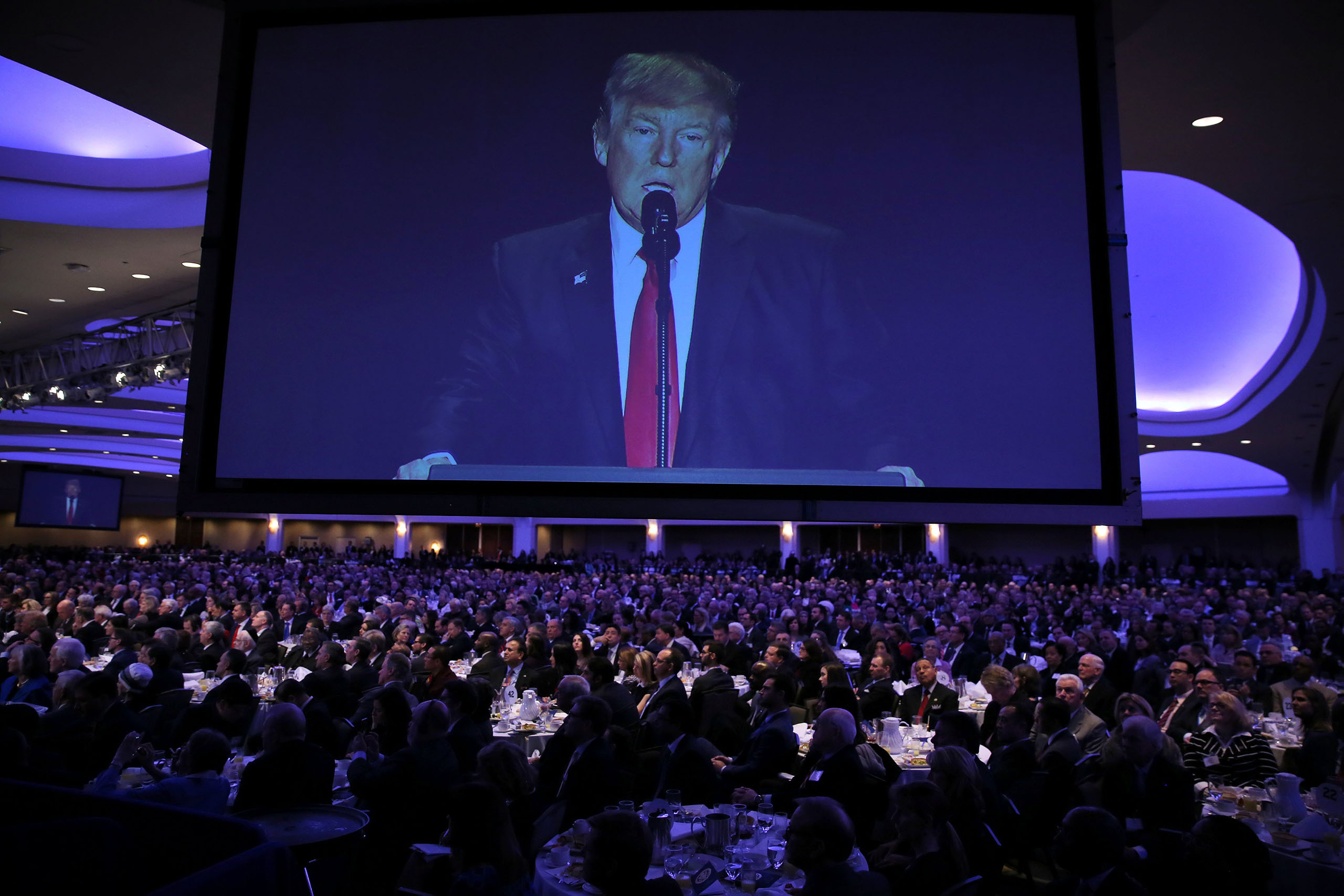 President Donald Trump is seen on a screen as he delivers remarks at the National Prayer Breakfast in Washington, on Feb. 2, 2017.