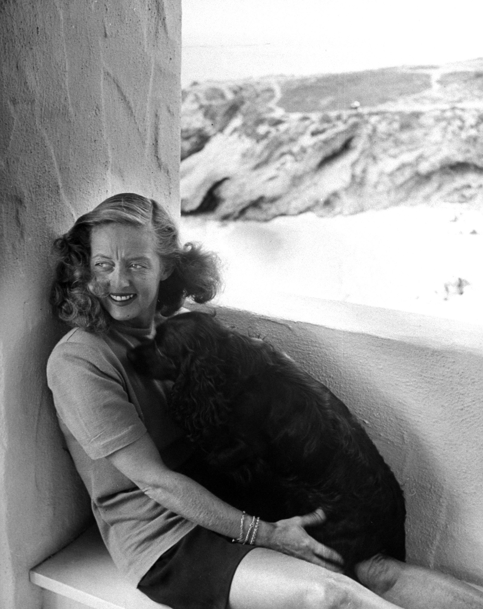 Bette Davis with her dog in California, 1947.