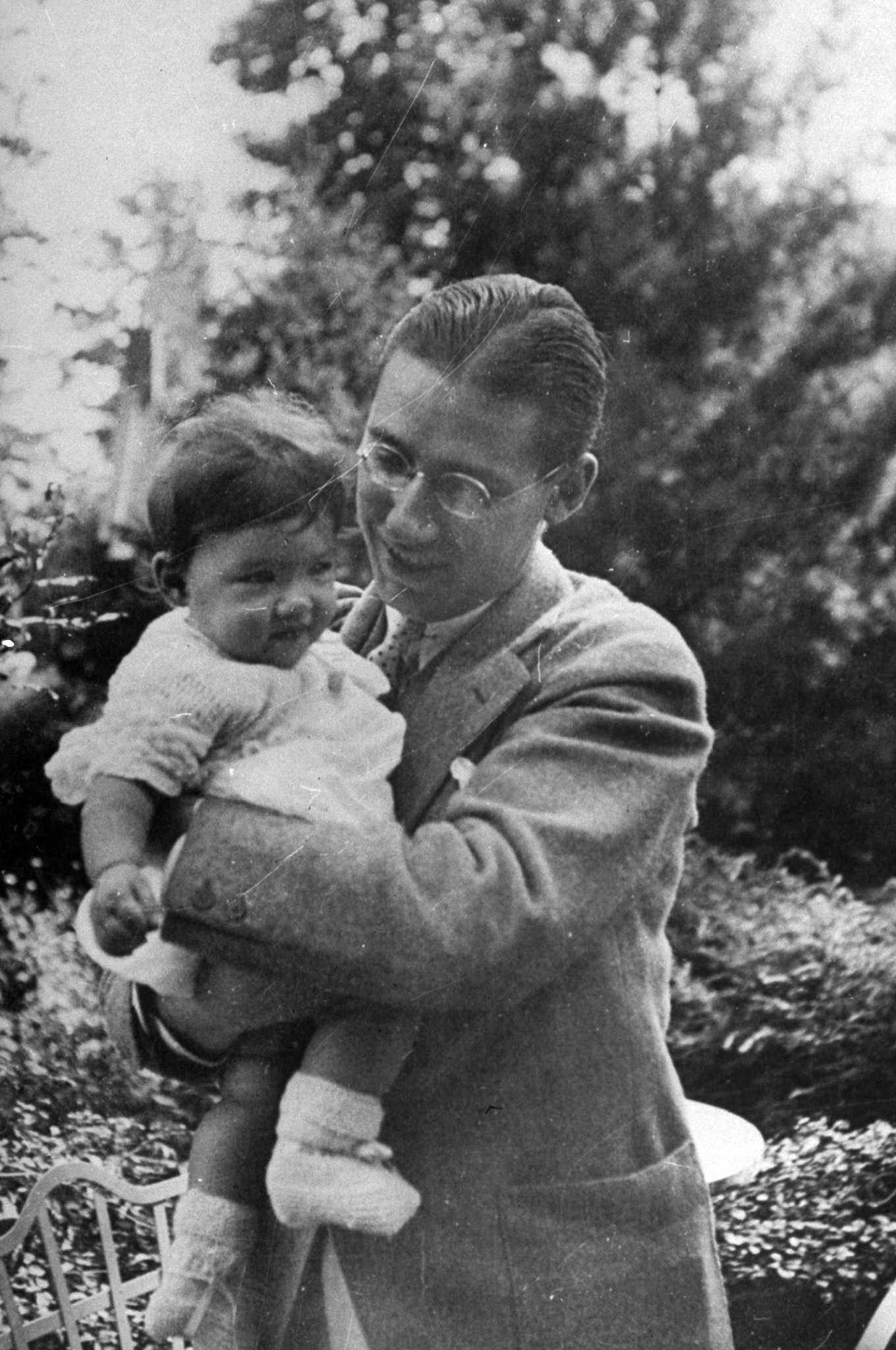 Poet Ogden Nash holding his daughter Jill, 1951.
