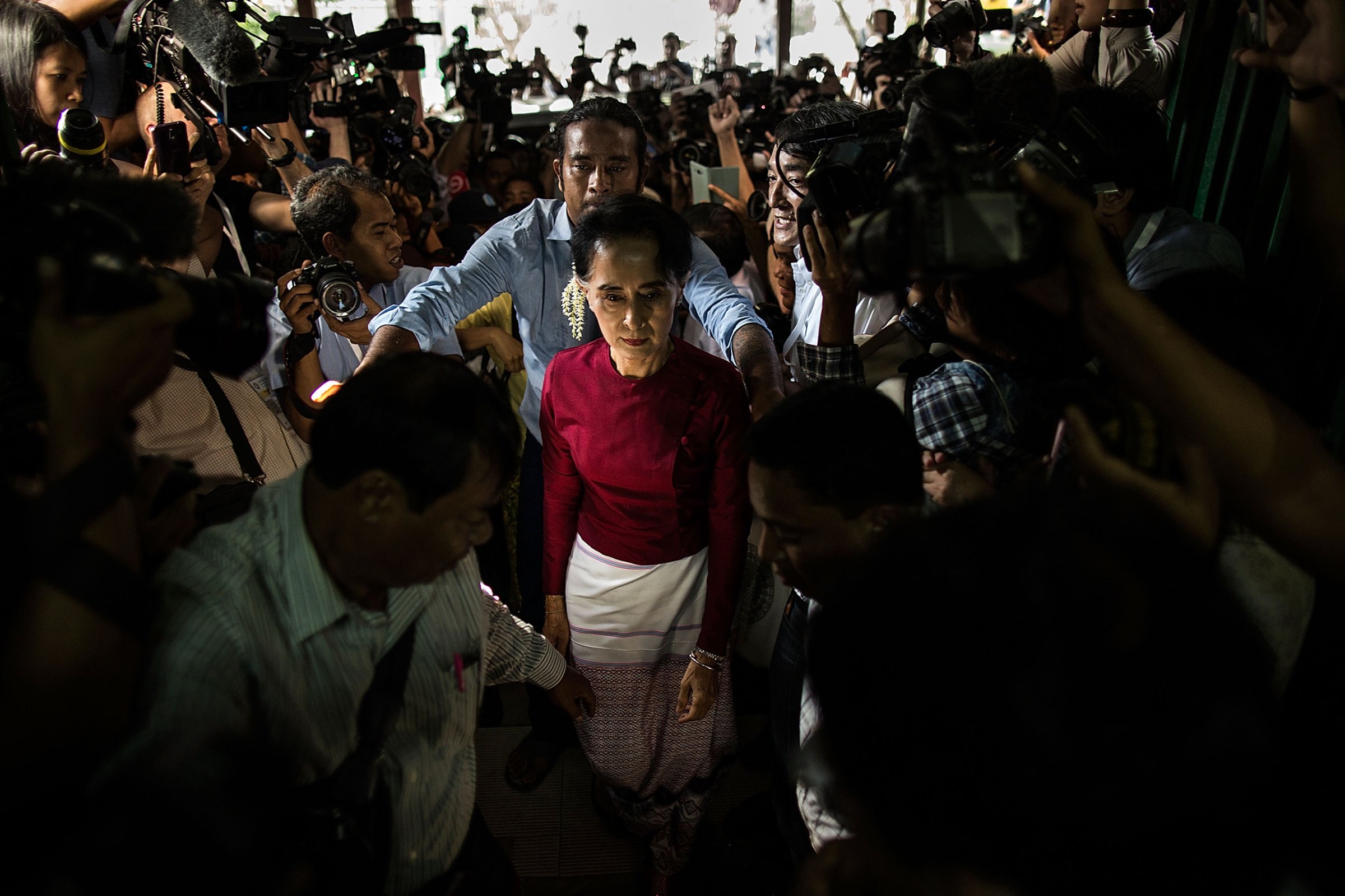 Aung San Suu Kyi arrives at the polling station to cast her vote during Myanmar's first free election a quarter-century in Yangon on Nov. 8, 2015.