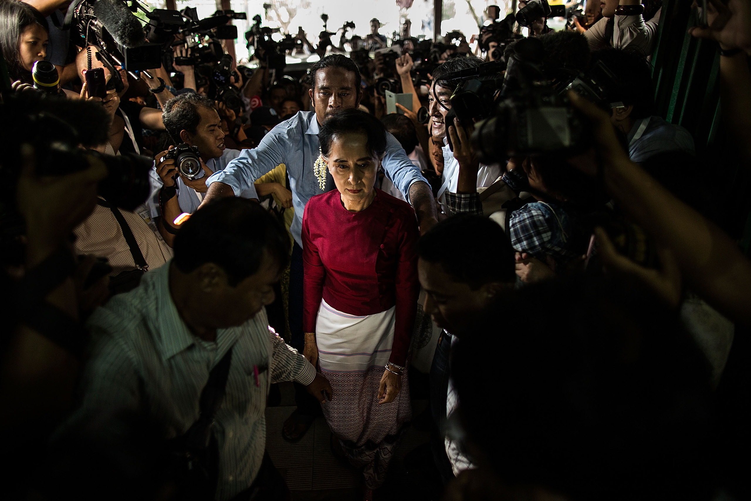 Aung San Suu Kyi arrives at the polling station to cast her vote during Myanmar's first free election in a quarter-century in Yangon, Myanmar, on Nov. 8, 2015 (Lam Yik Fei—Getty Images)