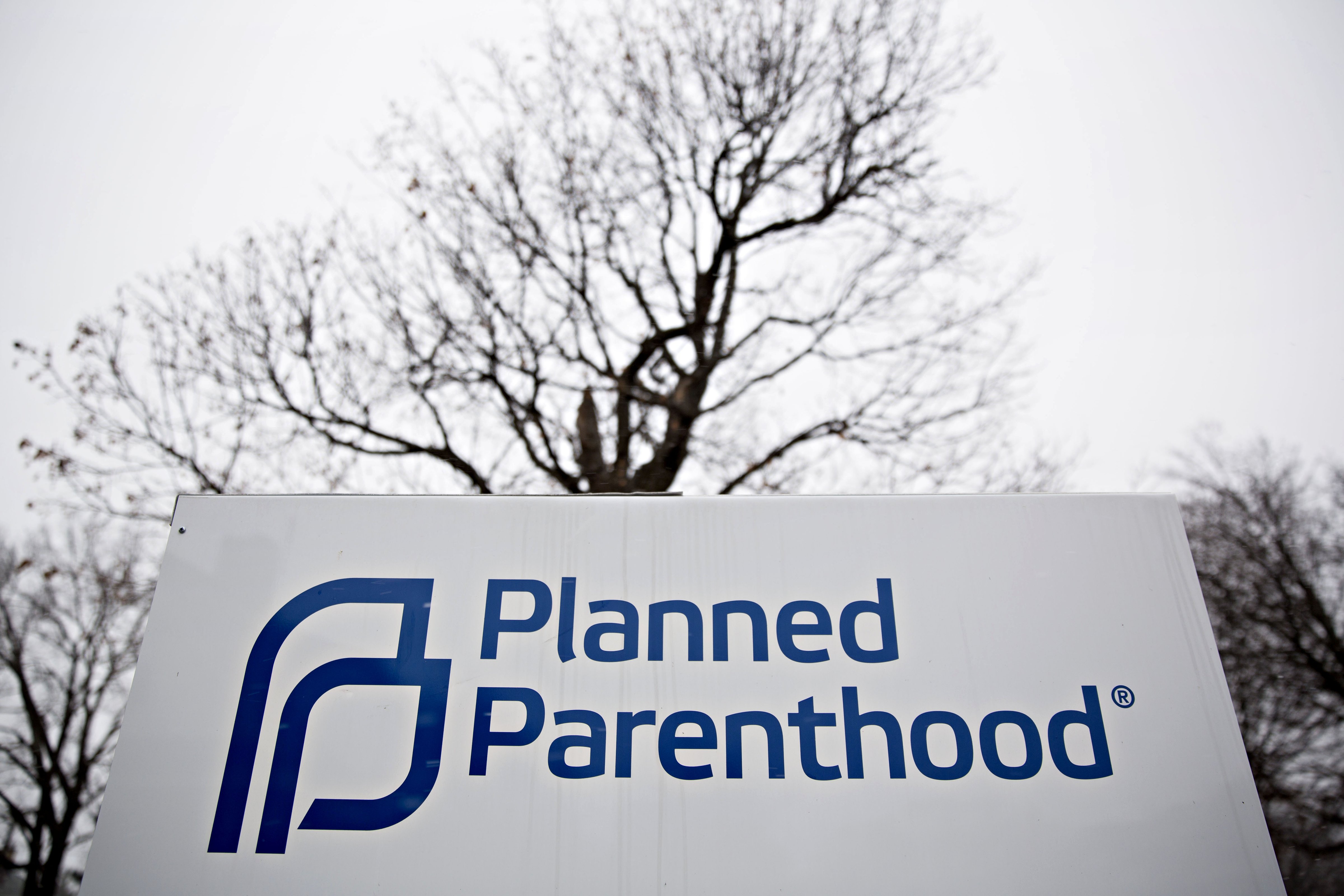 Signage is displayed outside a Planned Parenthood office in Peoria, Illinois, U.S., on Friday, Dec. 16, 2016. Republicans are thinking ahead to regulations Obama might still try to complete before he leaves office, including a pending rule barring states from blocking funds to Planned Parenthood. Photographer: Daniel Acker/Bloomberg via Getty Images (Bloomberg—Bloomberg via Getty Images)