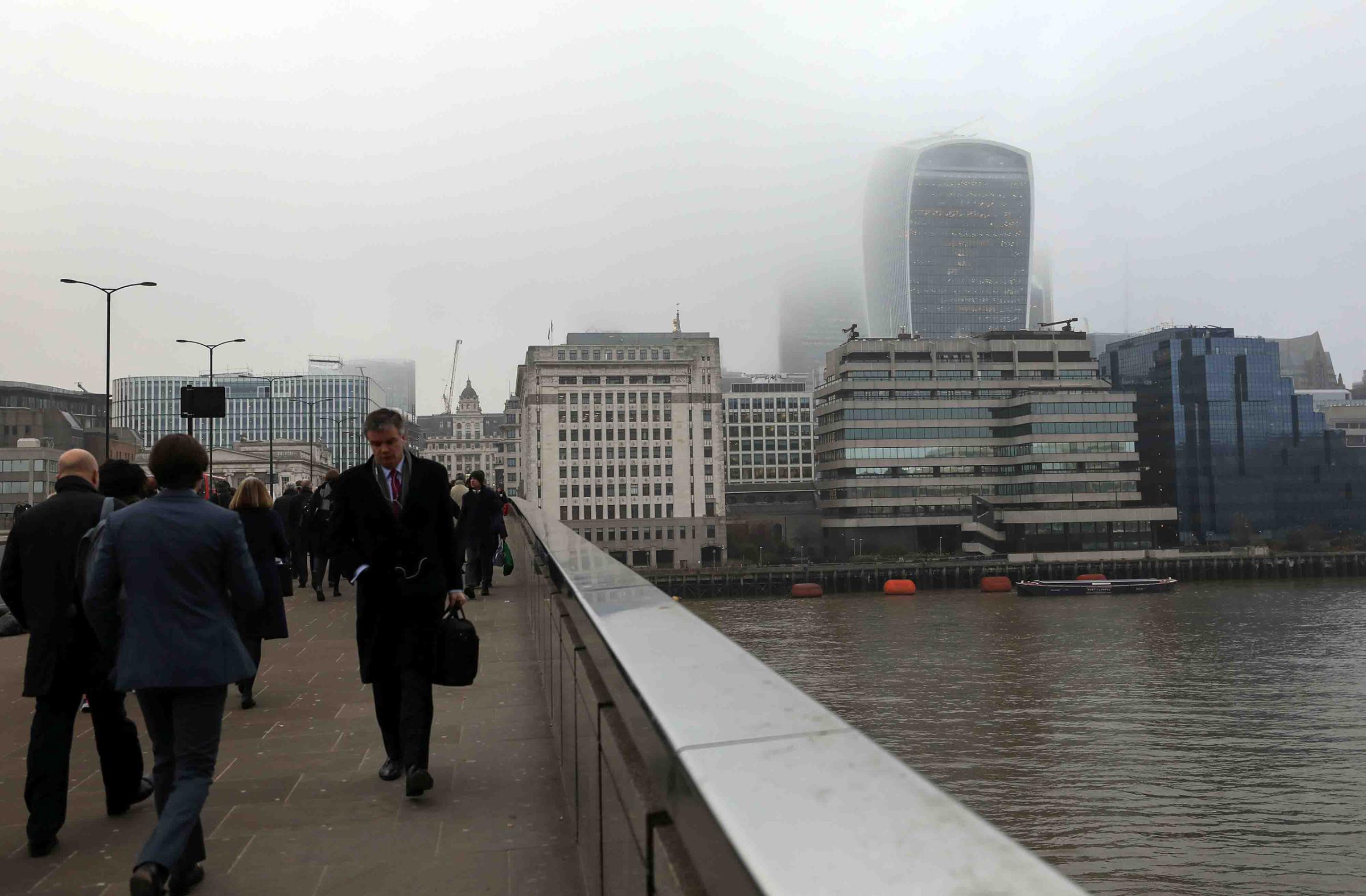 Pedestrians pass over London Bridge on Feb. 8, 2017. The city's poor air quality set a modern record at the end of January.