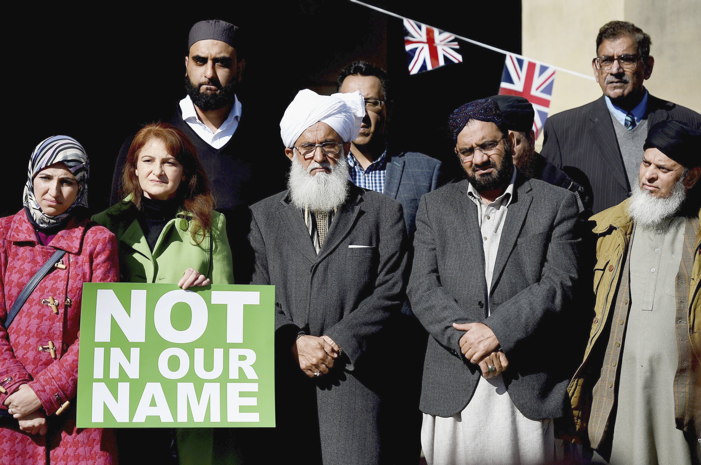 Muslim leaders at a Birmingham, England, rally against terrorism