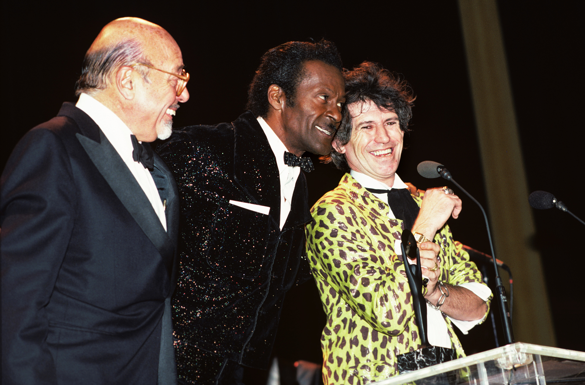 From left: Ahmet Ertegun, Chuck Berry and Keith Richards at the Rock and Roll Hall of Fame Awards in New York City, on Jan. 23, 1986.