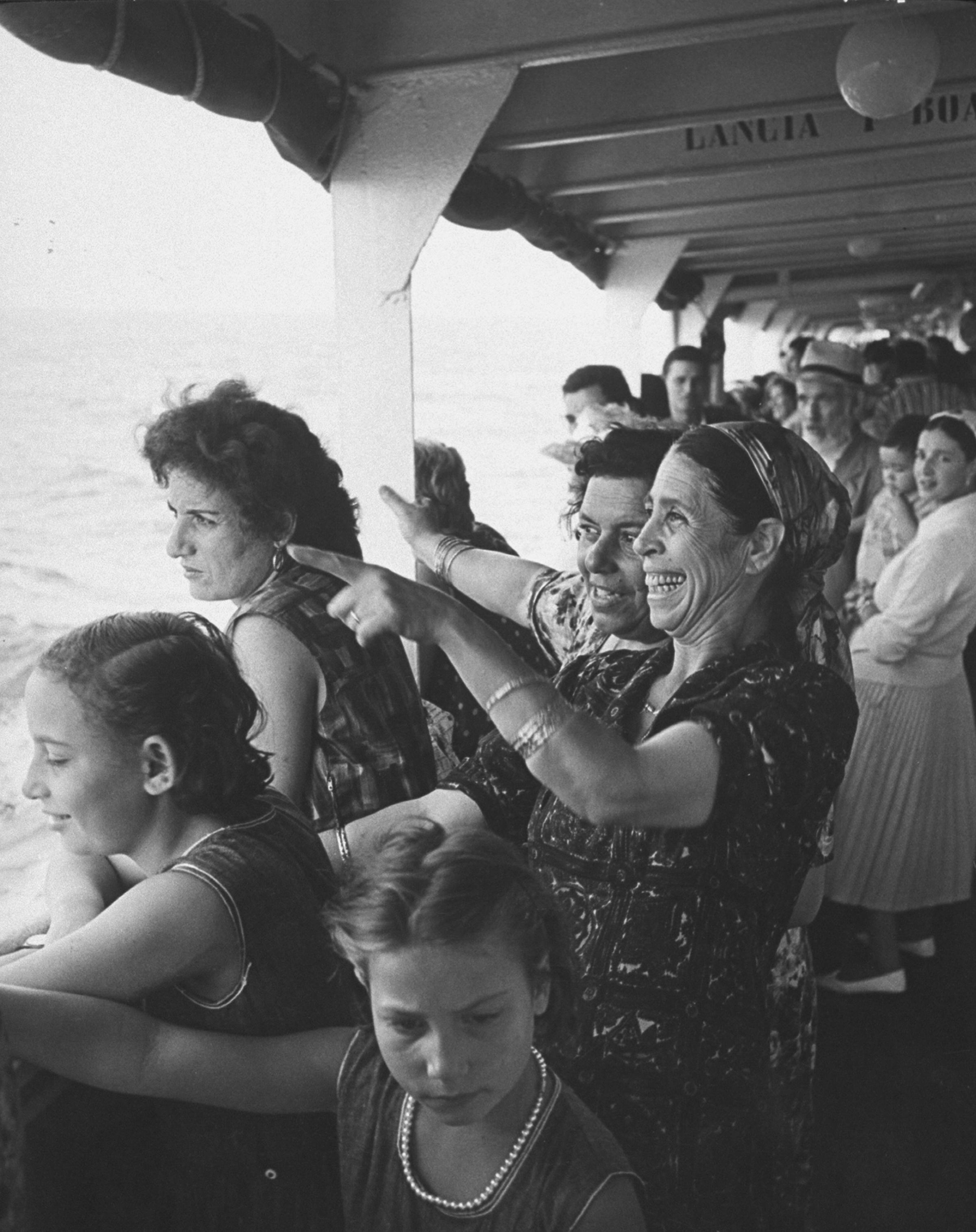 Enthused immigrants from Morocco arriving at Haifa via boat, 1962.