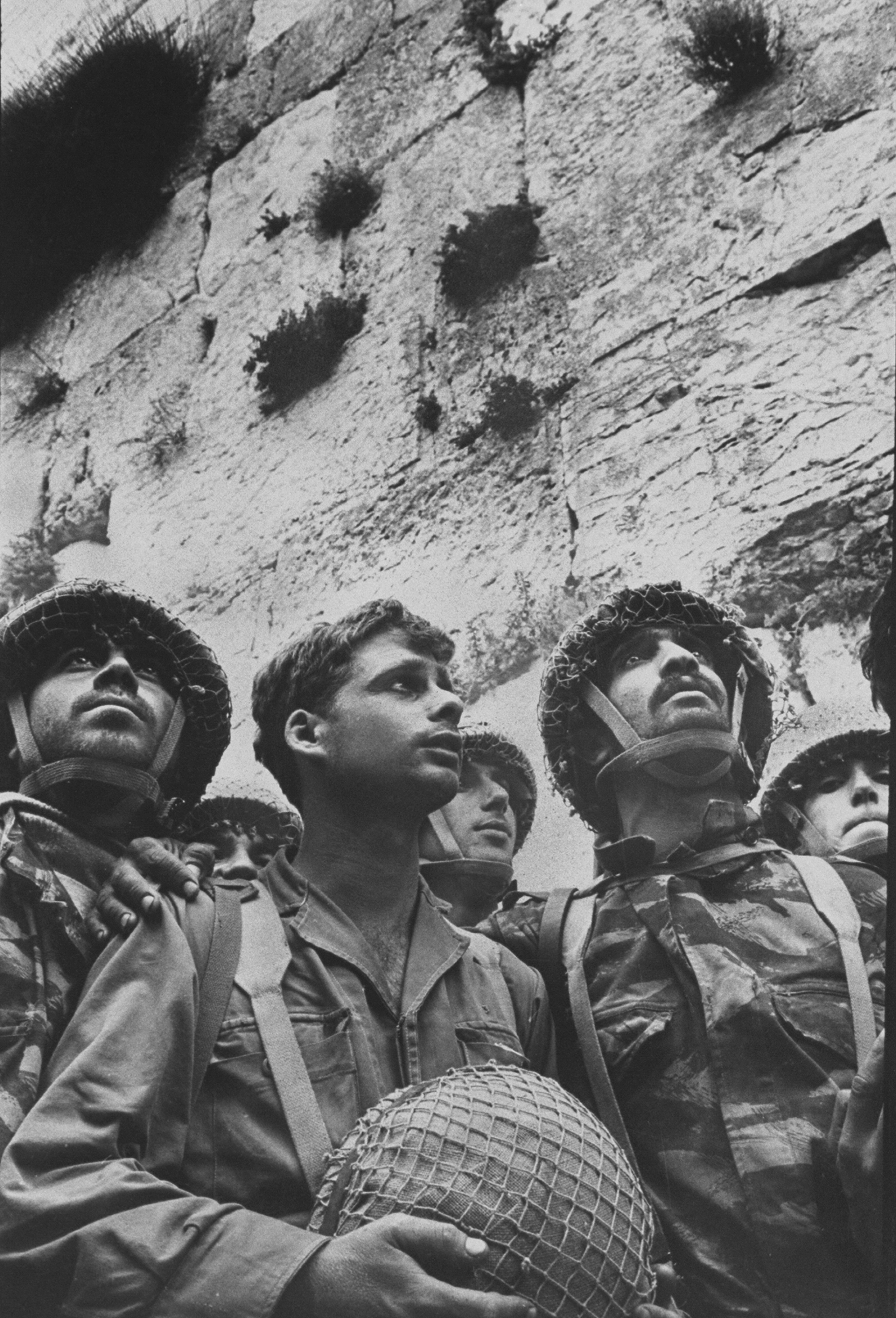 Small group of Israeli soldiers at the wailing wall after it was recaptured during the 1967 war.