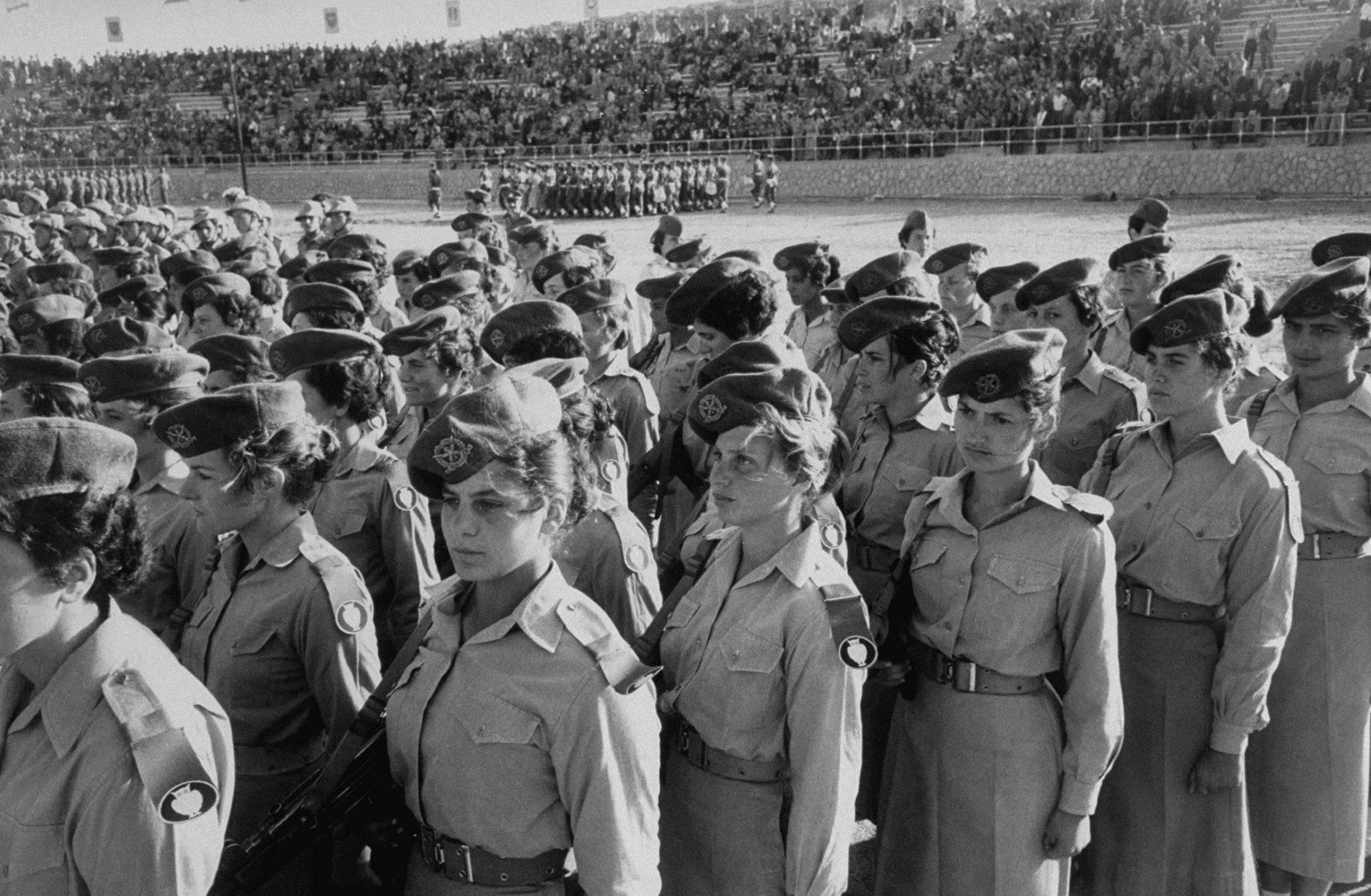 Israeli women's Army unit parading in Jerusalem carrying burp guns, on the 10th anniversary of Israeli nationhood,1956.