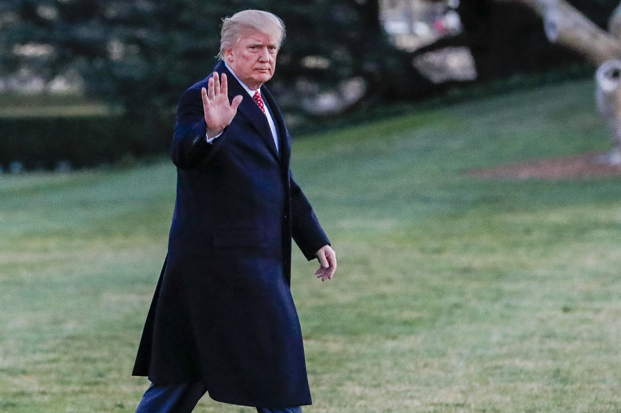 Donald Trump gestures after disembarking Marine One walking on the South Lawn towards the Oval Office of the White House in Washington, D.C., on March 5, 2017.