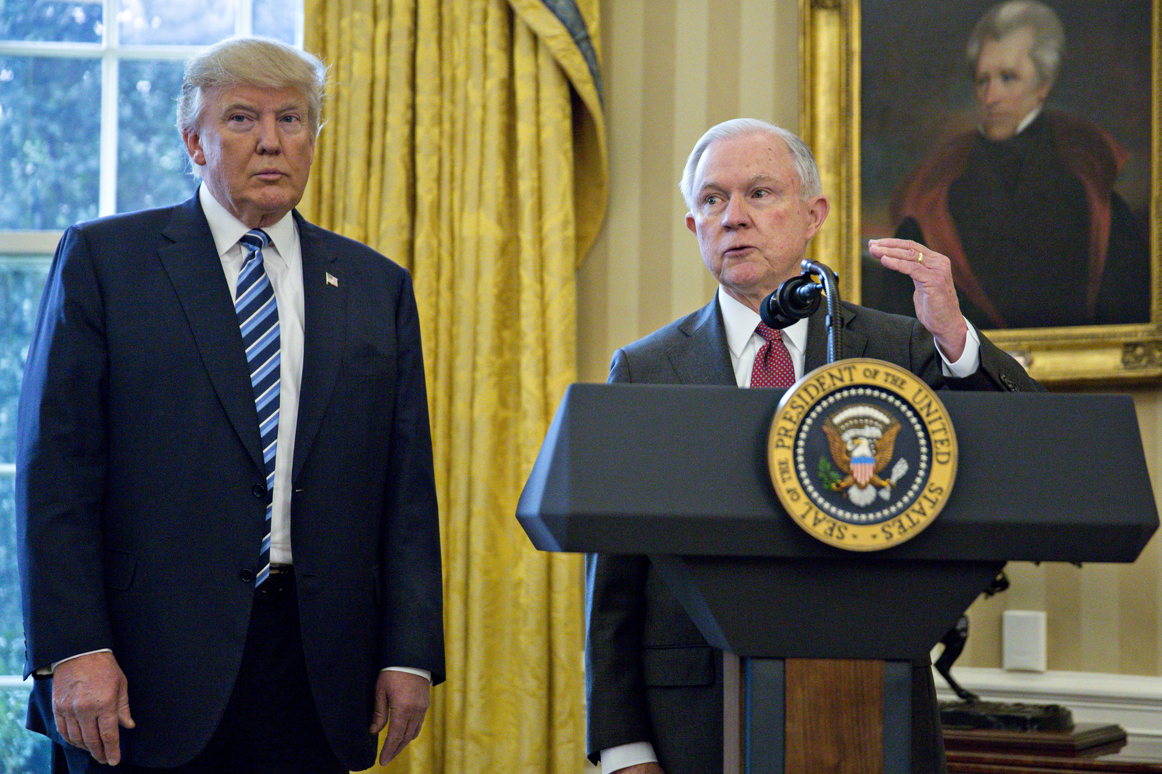 Jeff Sessions, U.S. attorney general, speaks as U.S. President Donald Trump, left, listens after Sessions was sworn in by U.S. Vice President Mike Pence, not pictured, in the Oval Office of the White House in Washington, D.C., U.S., on Thursday, Feb. 9, 2017. (Andrew Harrer—Bloomberg via Getty Images)