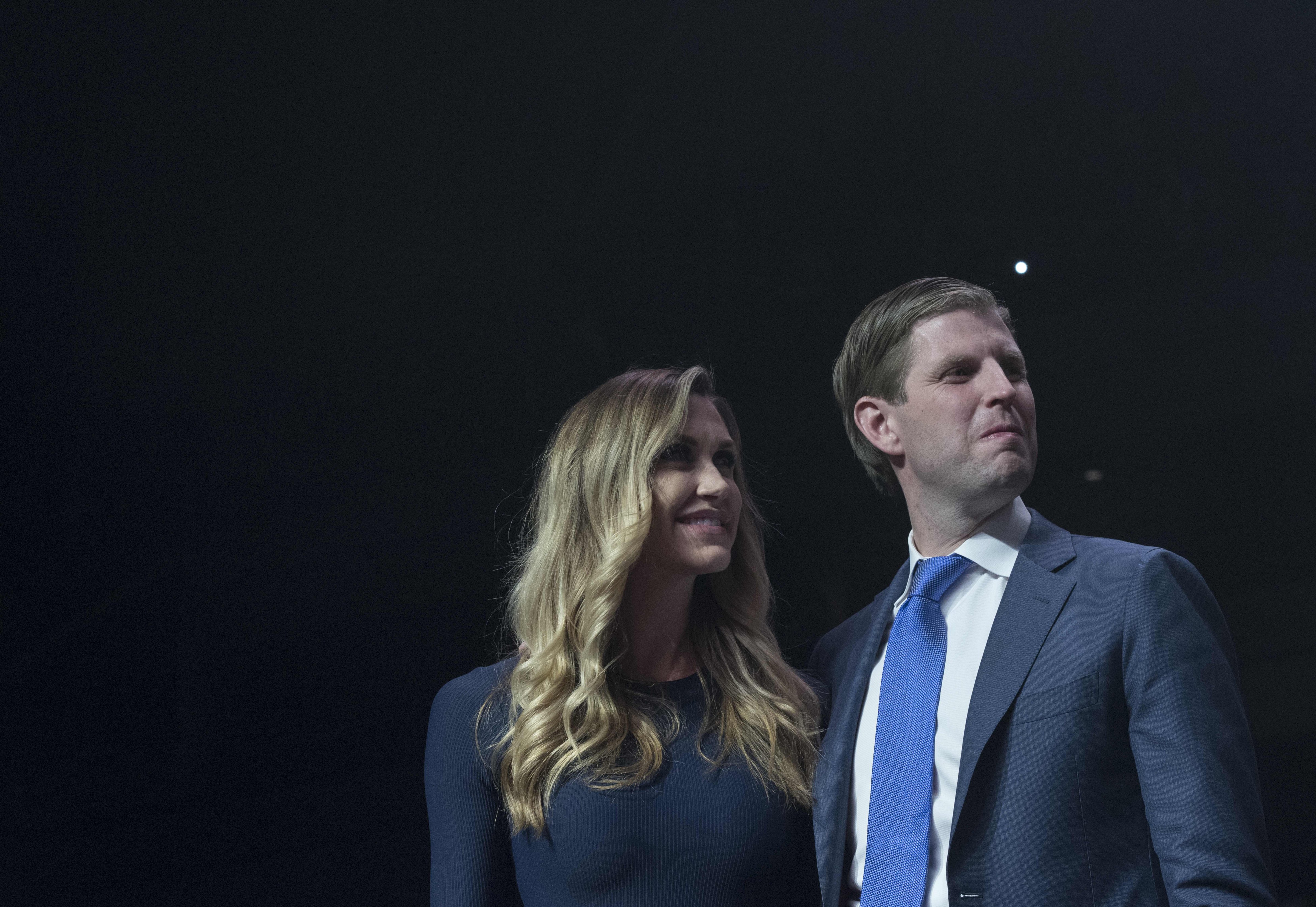 Eric Trump and his wife Lara watch Republican presidential nominee Donald Trump speak at rally at the SNHU Arena in Manchester, New Hampshire on November 7, 2016. (MANDEL NGAN—AFP/Getty Images)
