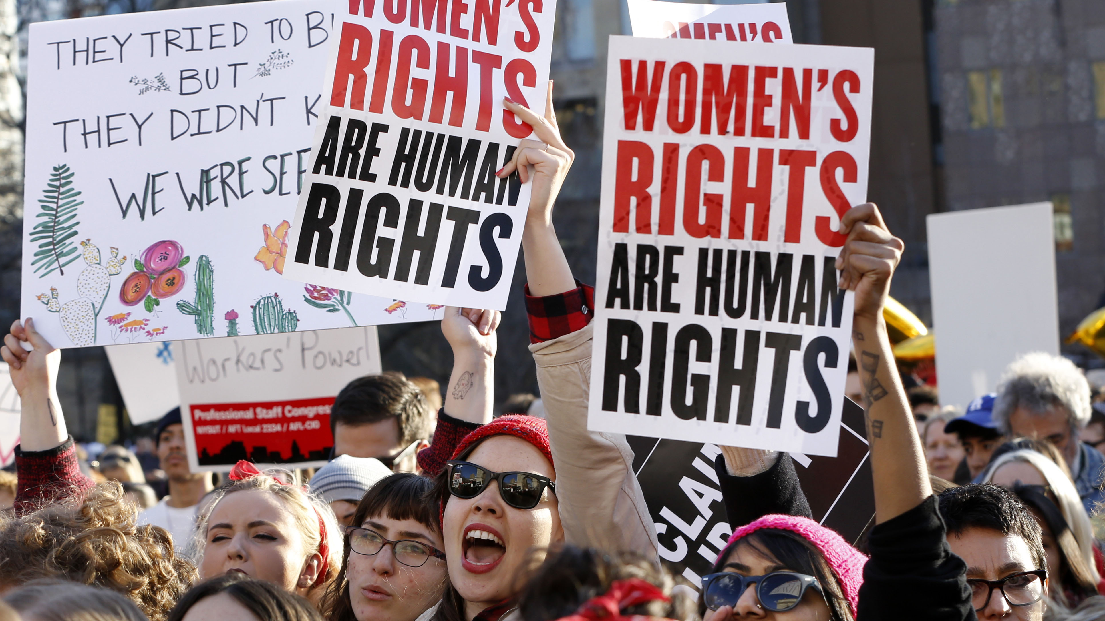 Women chant and raise their signs during a rally, part of International Women's Strike NYC, on March 8, 2017, at Washington Square Park in New York. (Kathy Willens—AP)