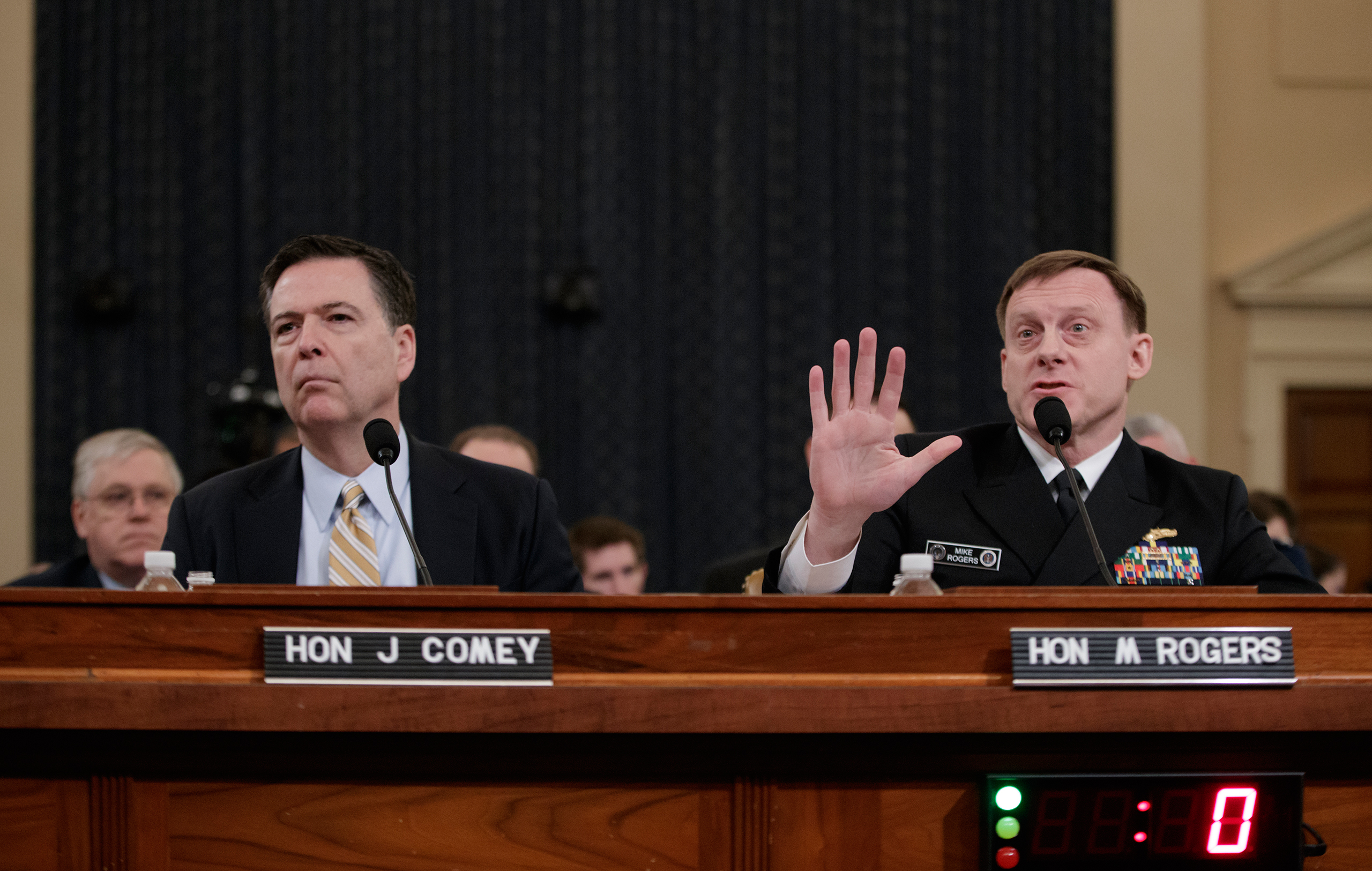 Both FBI Director Comey, left, and NSA chief Rogers said they could find no evidence for Trump's claims that Obama had bugged Trump's phone calls. (J. Scott Applewhite—AP)