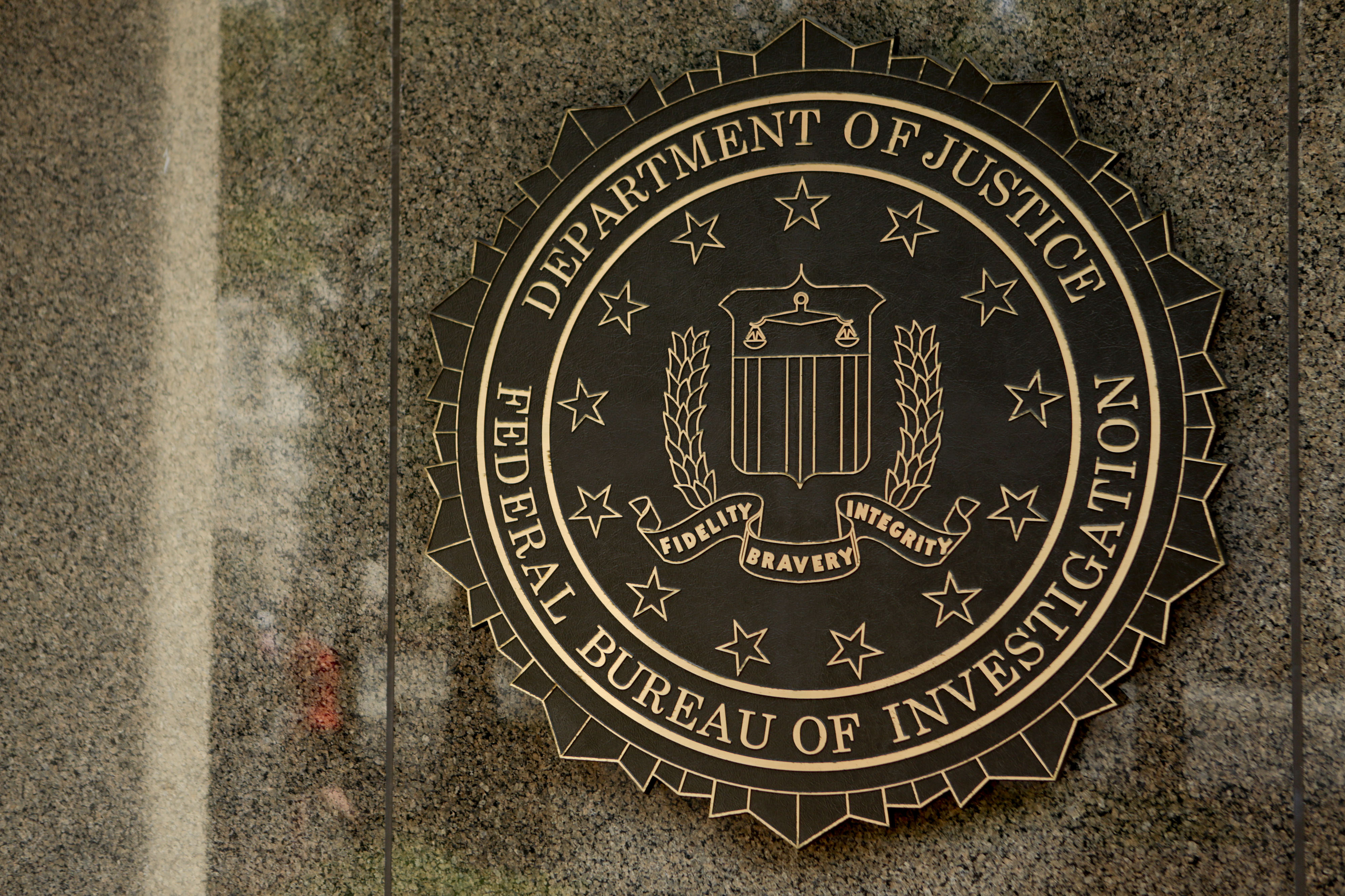 The seal of the Federal Bureau of Investigation (FBI) is seen at the J. Edgar Hoover building in Washington, D.C., U.S., on Aug. 8, 2013. (Andrew Harrer—Bloomberg/Getty Images)
