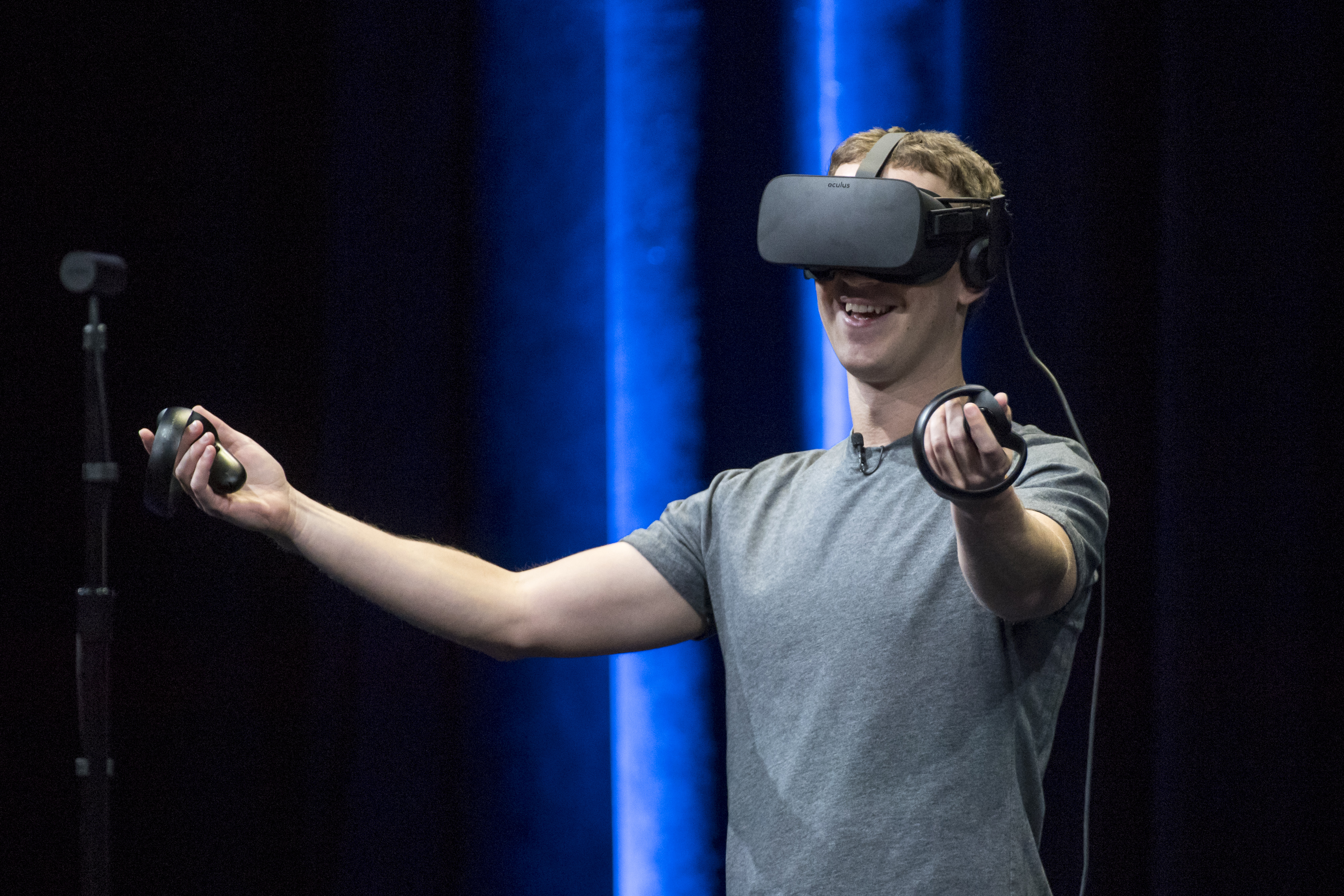 Mark Zuckerberg, chief executive officer and founder of Facebook Inc., demonstrates an Oculus Rift virtual reality (VR) headset and Oculus Touch controllers as the gives a demonstration during the Oculus Connect 3 event in San Jose, California, U.S., on Thursday, Oct. 6, 2016. (Bloomberg&mdash;Bloomberg via Getty Images)