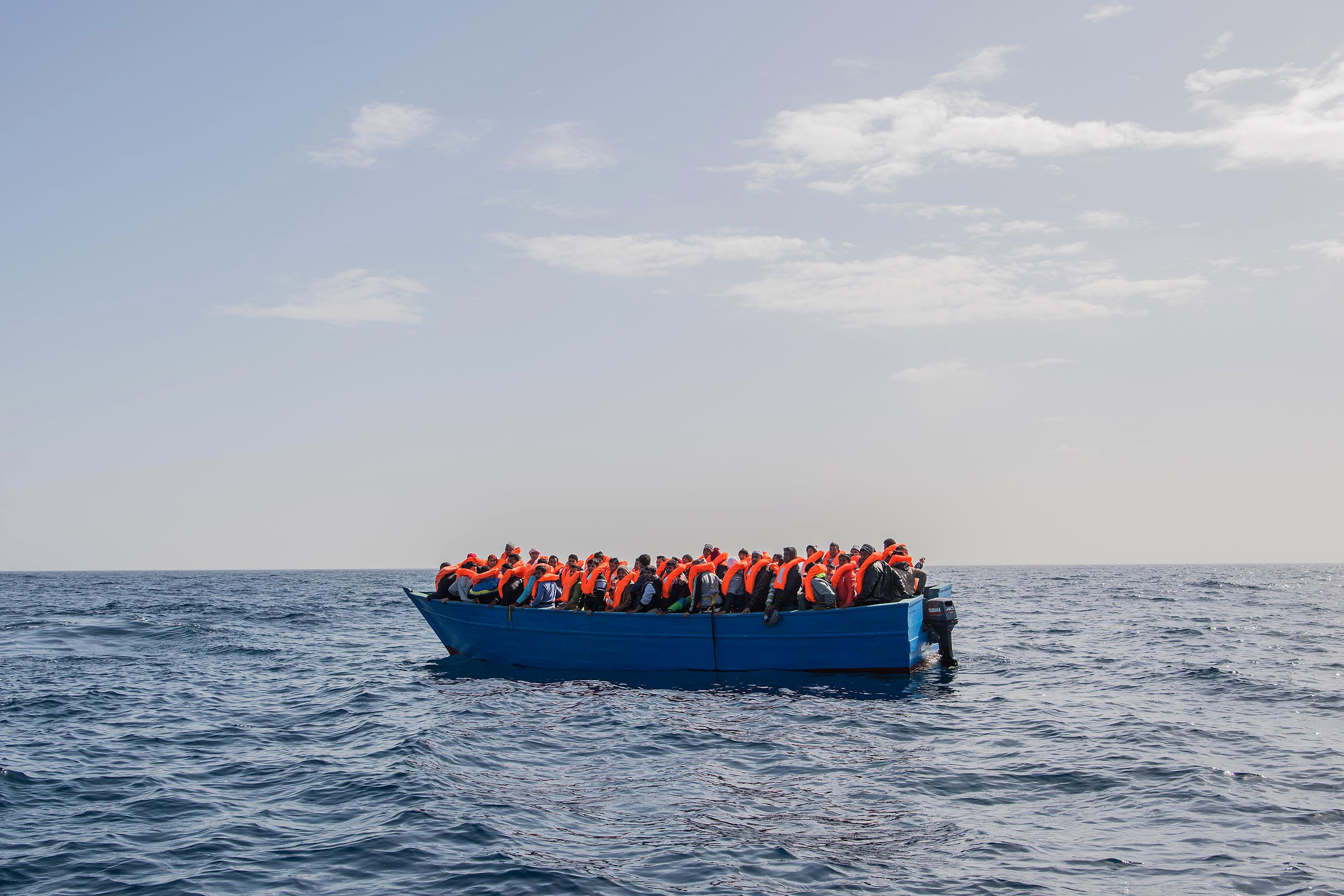 Migrants and refugees are assisted by the Spanish NGO Proactiva Open Arms 20 miles north of Sabratha, Libya on Feb. 18, 2017. (David Ramos—Getty Images)