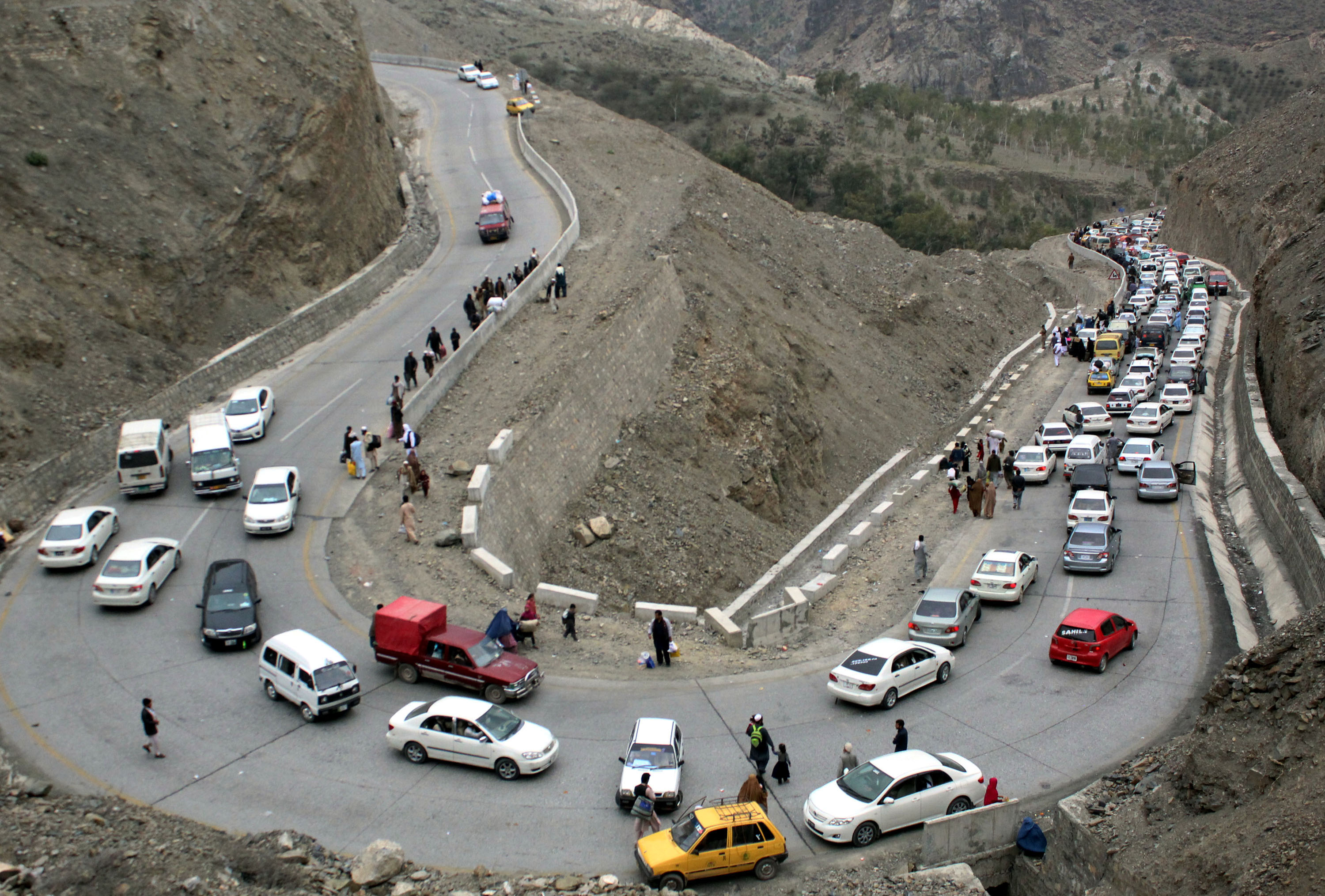 Vehicles en route to Afghanistan line up near the Pakistani-Afghan border in northwest Pakistan's Torkham on March 7, 2017 (Sidique—Xinhua News Agency/Getty Images)