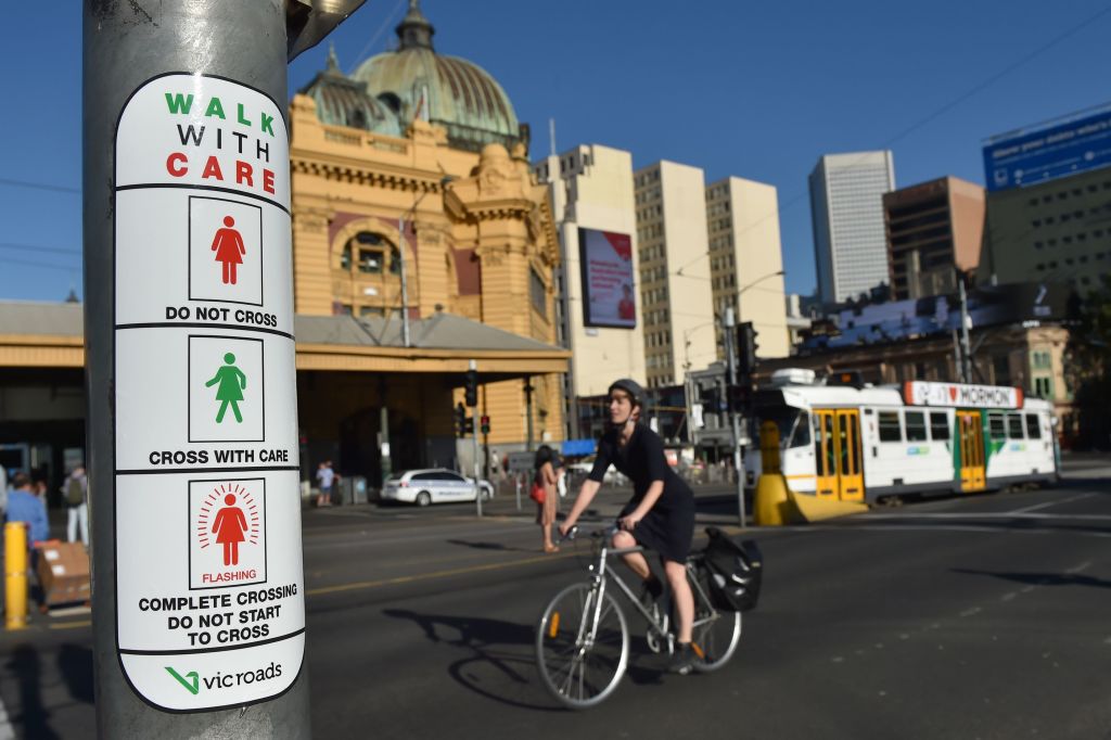 Instructions for new pedestrian traffic signals designed to equal the gender balance on International Women's Day in Melbourne on March 8, 2017. (Paul Crock —AFP/Getty Images)