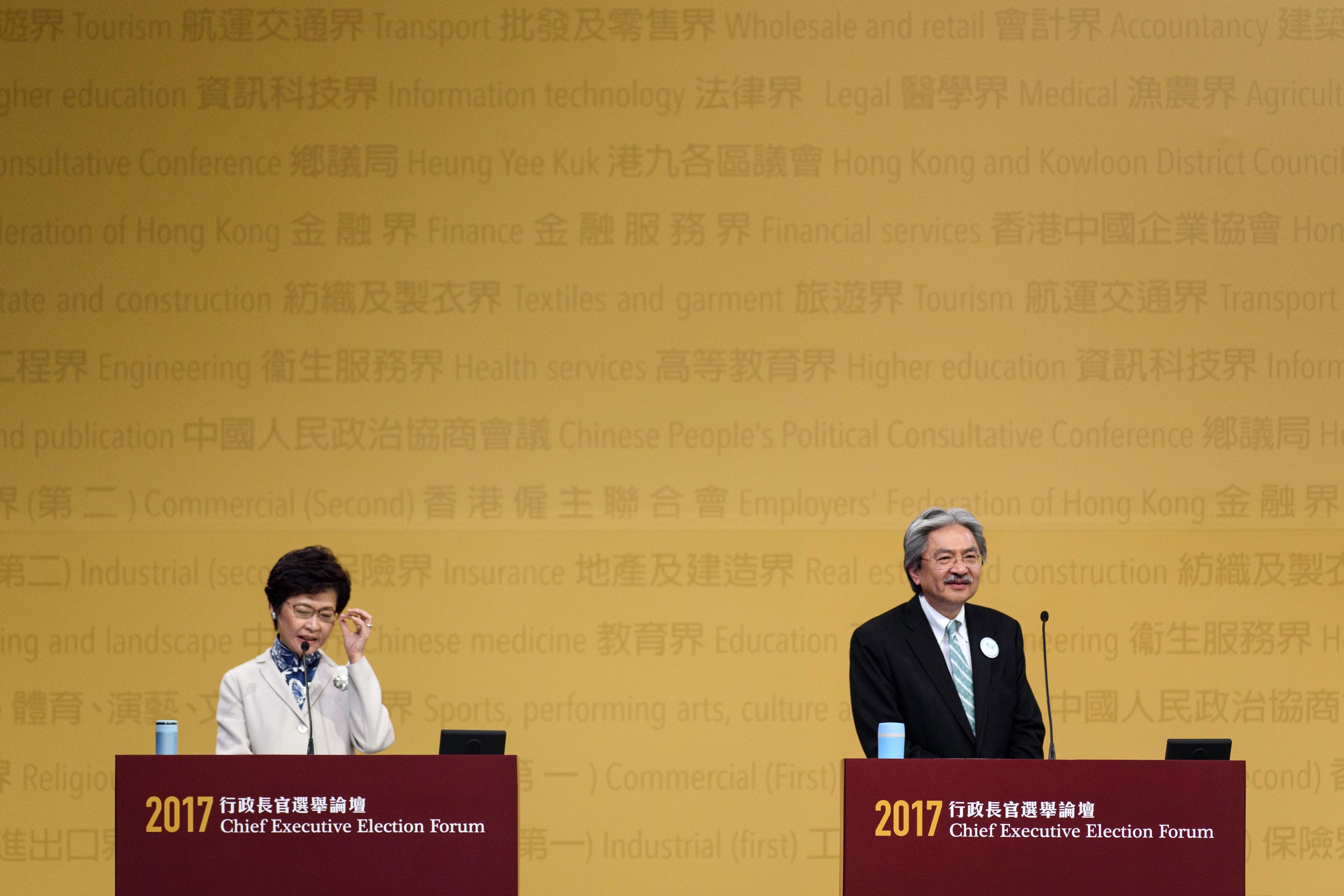 Hong Kong's Chief Executive candidates Carrie Lam and John Tsang on stage during the Chief Executive Election Forum in Hong Kong on March 19, 2017 (Tengku Bahar—AFP/Getty Images)