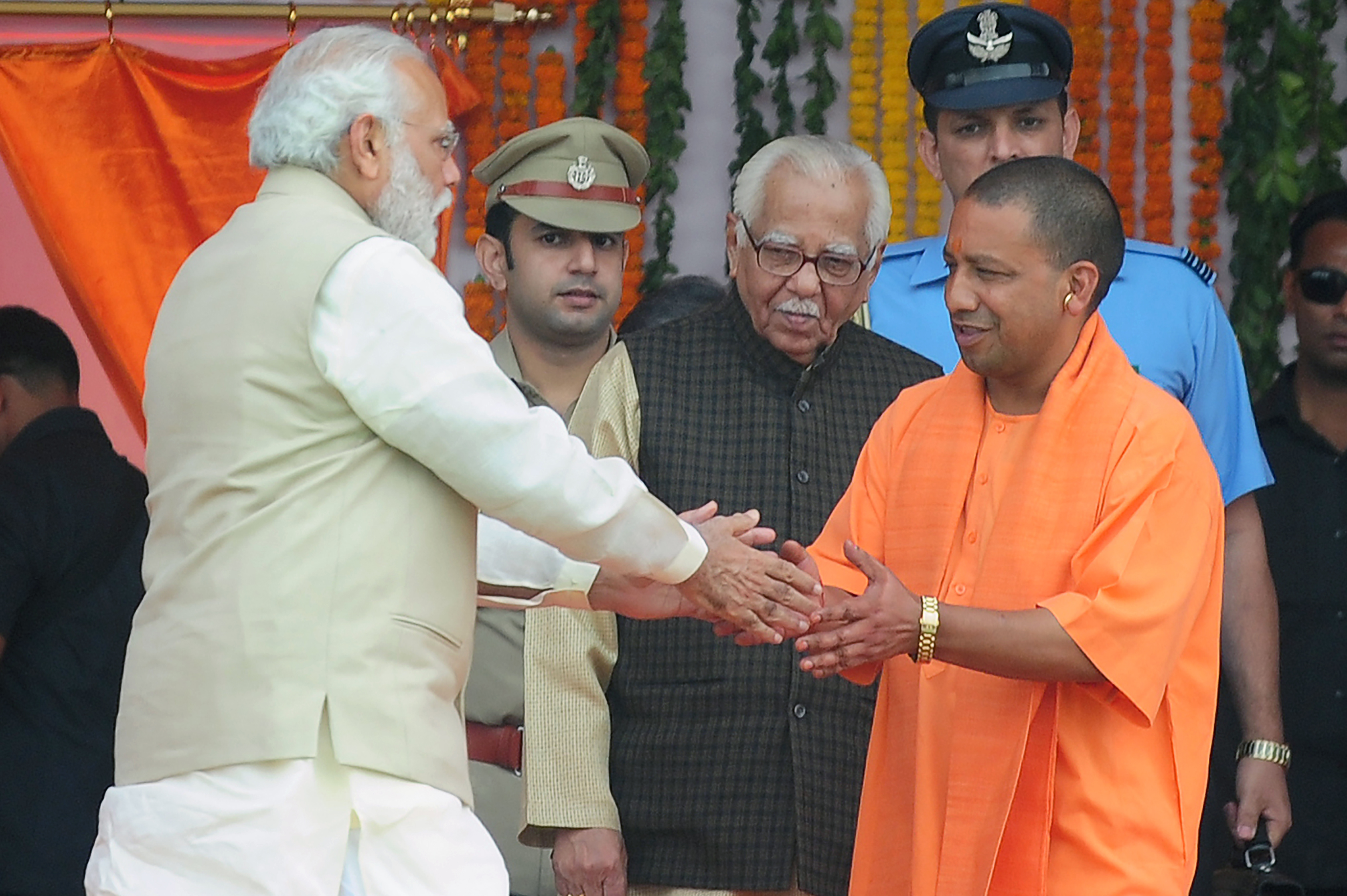 Indian Prime Minister Narendra Modi, left, greets Yogi Adityanath, chief minister of Uttar Pradesh state, at his swearing-in ceremony in Lucknow, India, on March 19, 2017 (Sanjay Kanojia—AFP/Getty Images)