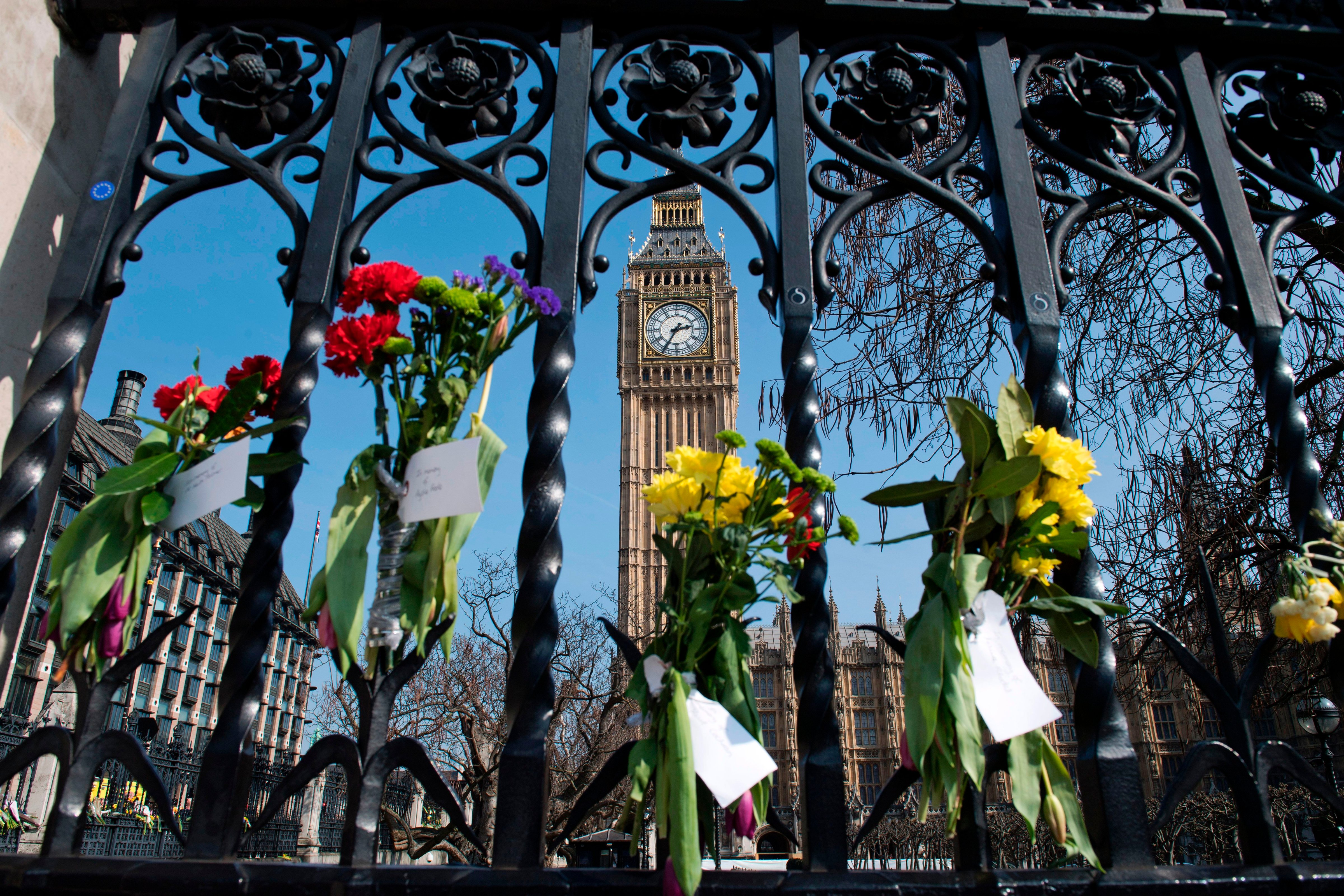 Floral tributes to the victims of the March 22 terror attack are seen on outside the Houses of Parliament in Westminster, central London, on March 27, 2017 (Justin Tasllis—AFP/Getty Images)