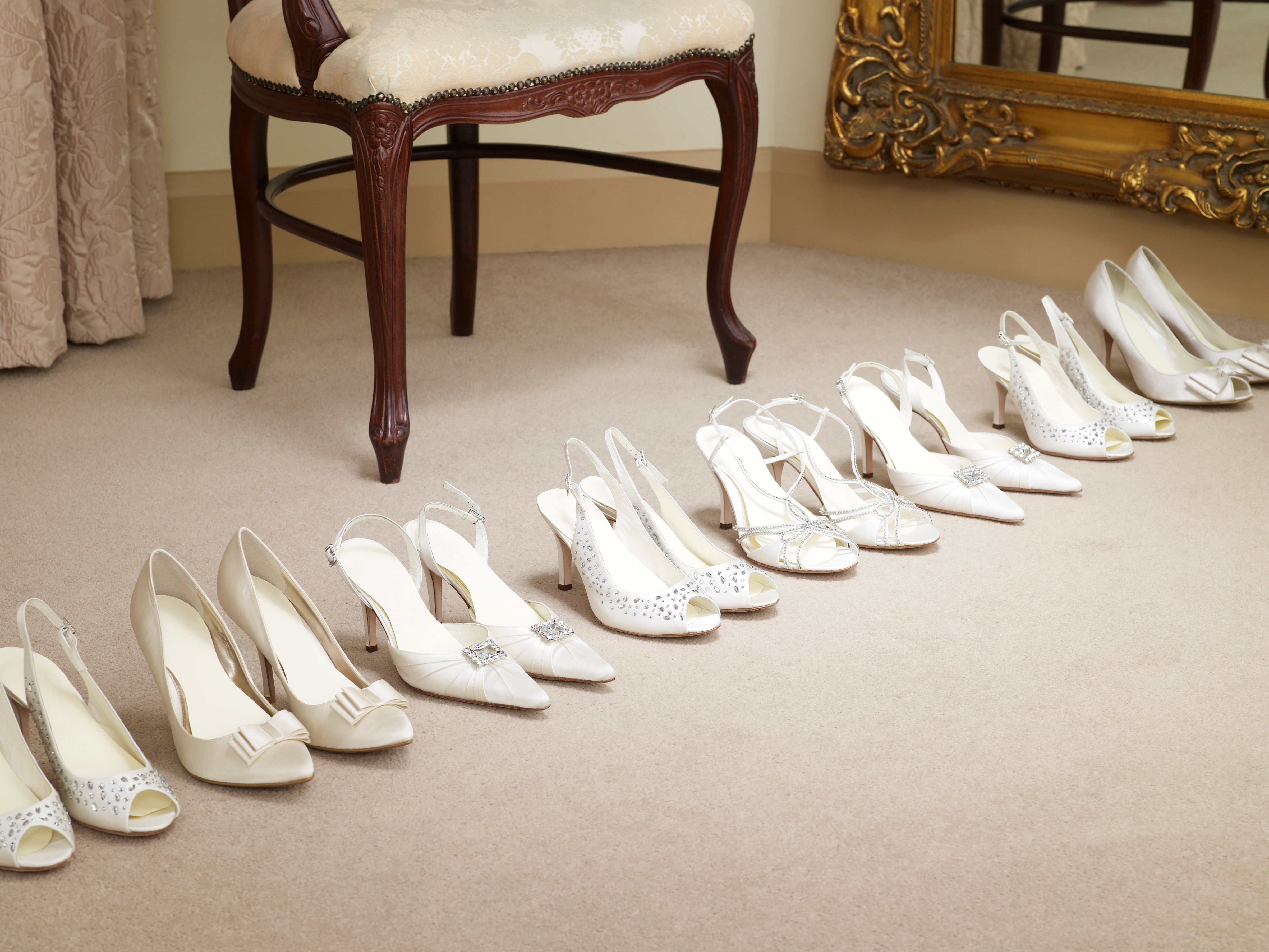 Row of elegant shoes in bridal wear store