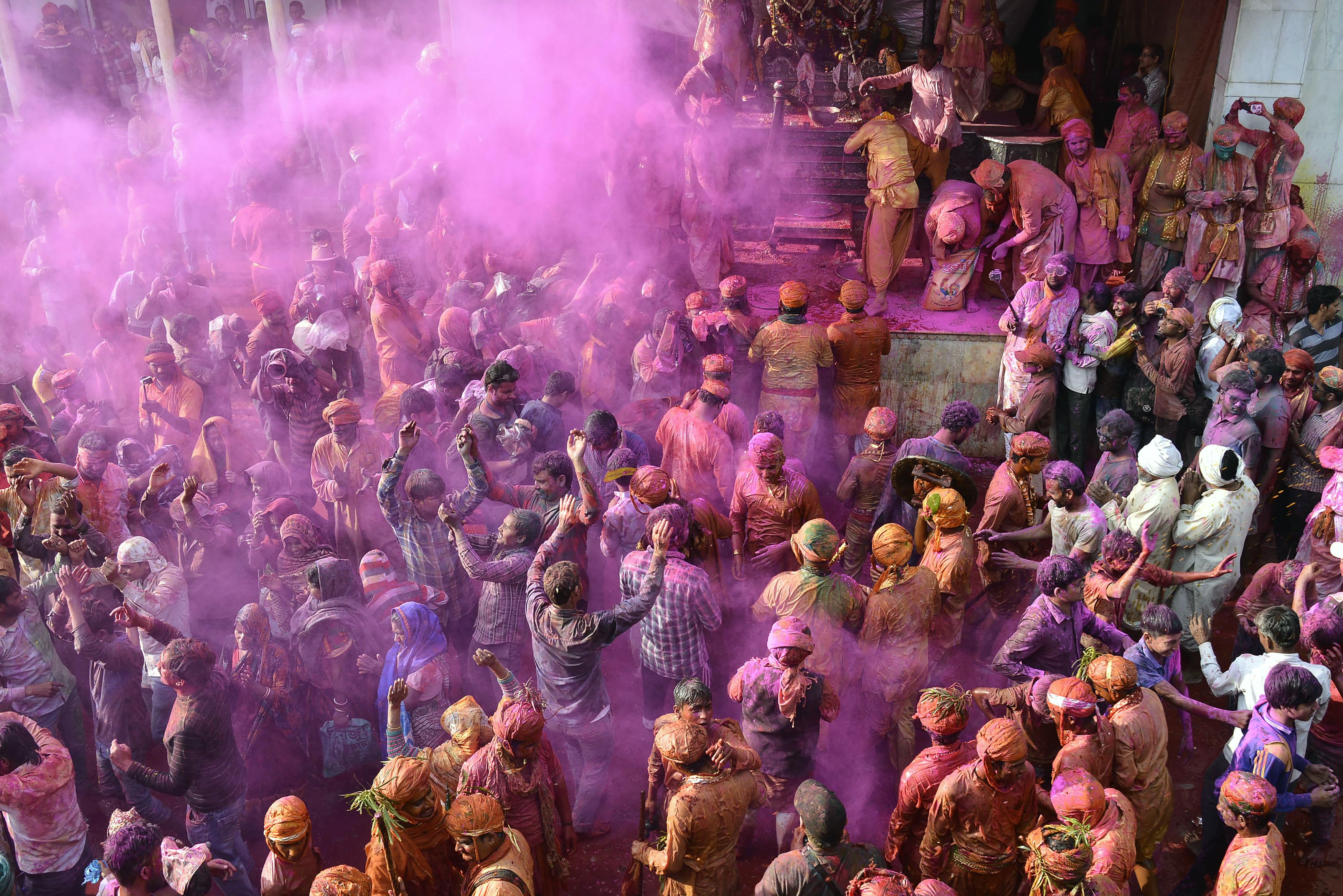 Indian Hindu devotees celebrate Holi, the spring festival of colours, during a traditional gathering at Nandgaon village in Uttar Pradesh state on March 7, 2017. (AFP/Getty Images)