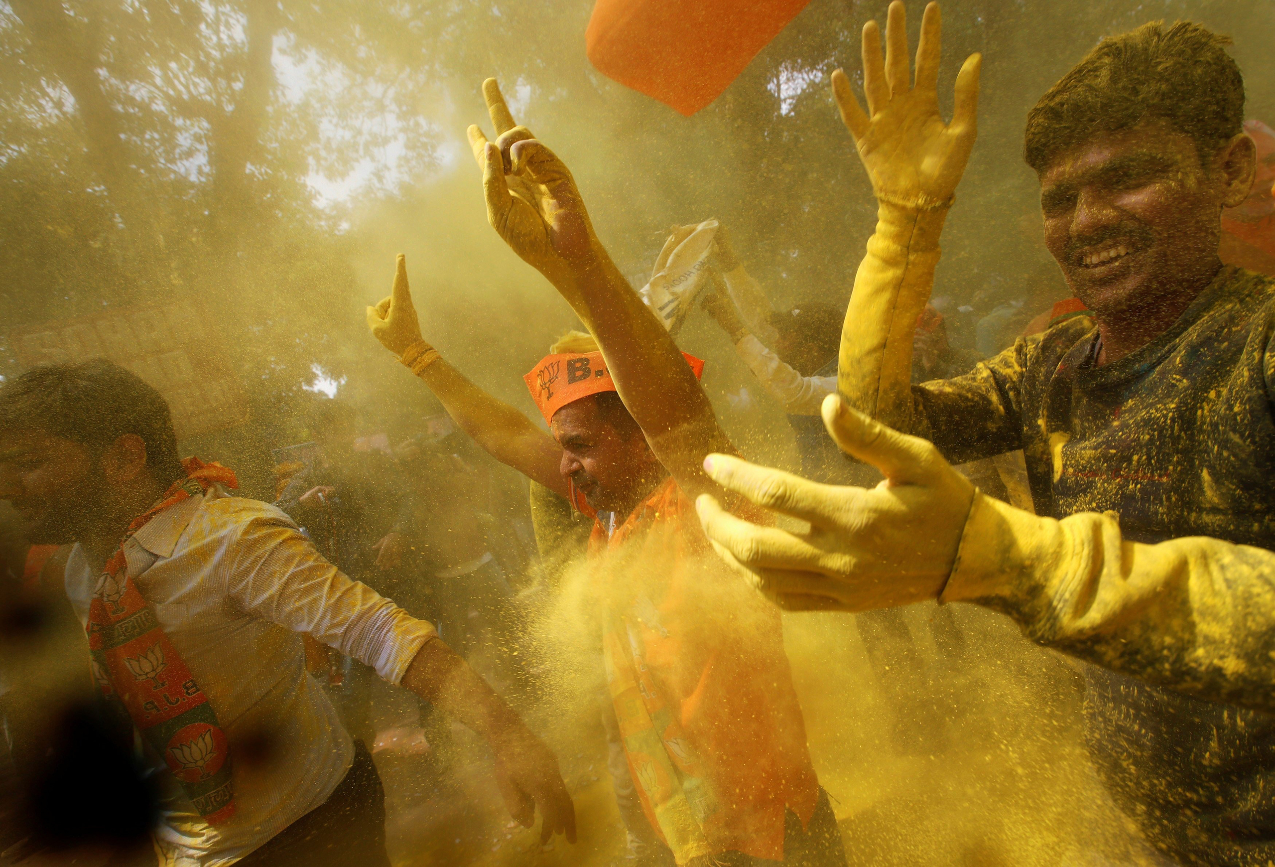Modi’s supporters in New Delhi celebrate his big victory in crucial Uttar Pradesh. (Adnan Abidi—Reuters)