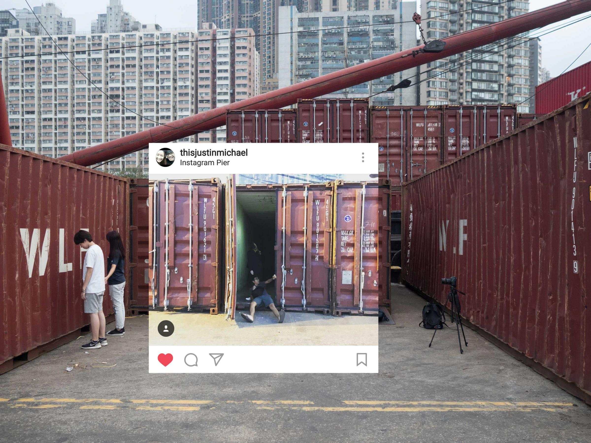 Hong Kong (Hong Kong SAR, China); Date (10, 30, 2016); two youngsters make selfies on the Pier. "Instagram pier" is a public cargo pier located on the west side of Hong Kong island; here locals gather for fishing, excercising or walking their pets. More recently the Pier has raised to fame as the “instagram Pier”, whereyoung Hong Kongers and instagrammers come for selfies and scenic photos. I have recently begun curating its "instagram" dedicated account (@insta_pier).