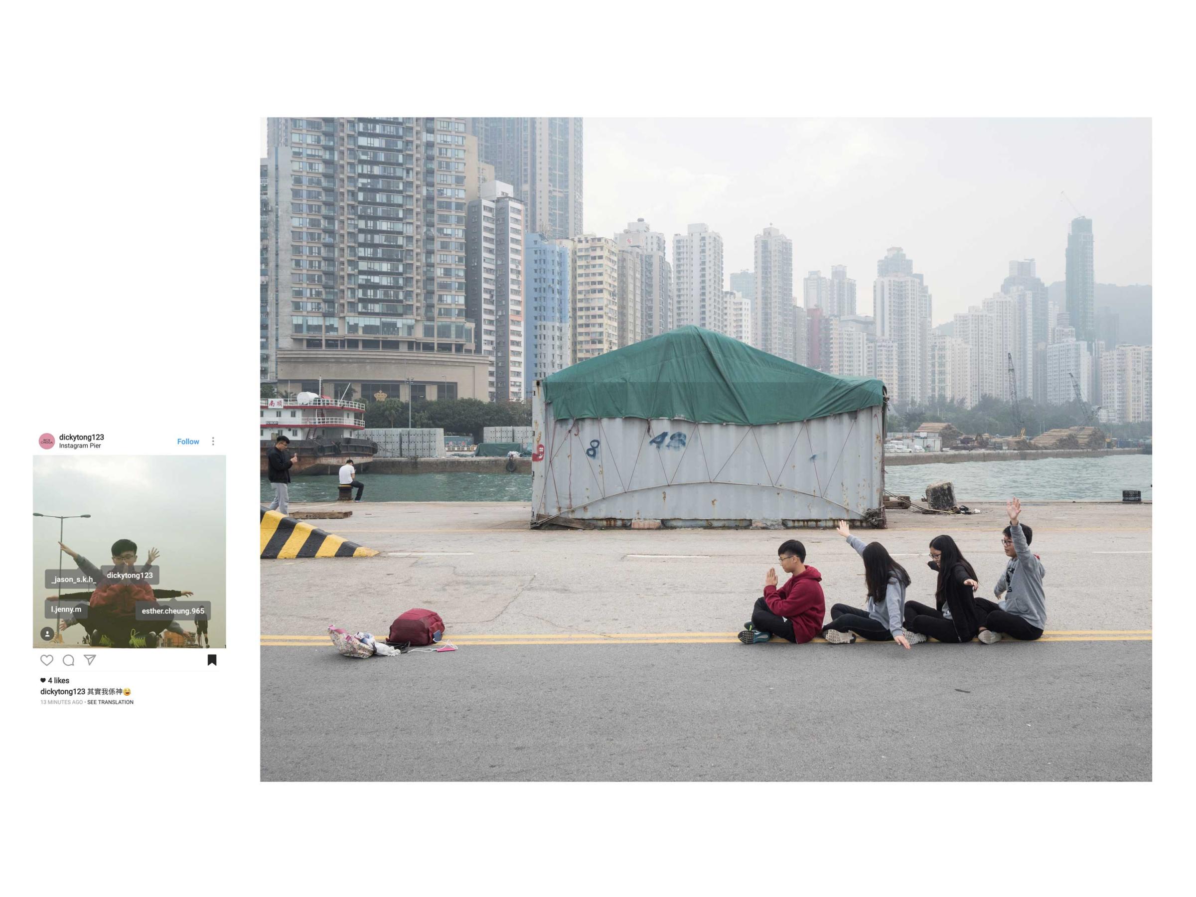 Four Instagram users take a photo on the "Instagram Pier" in Hong Kong.