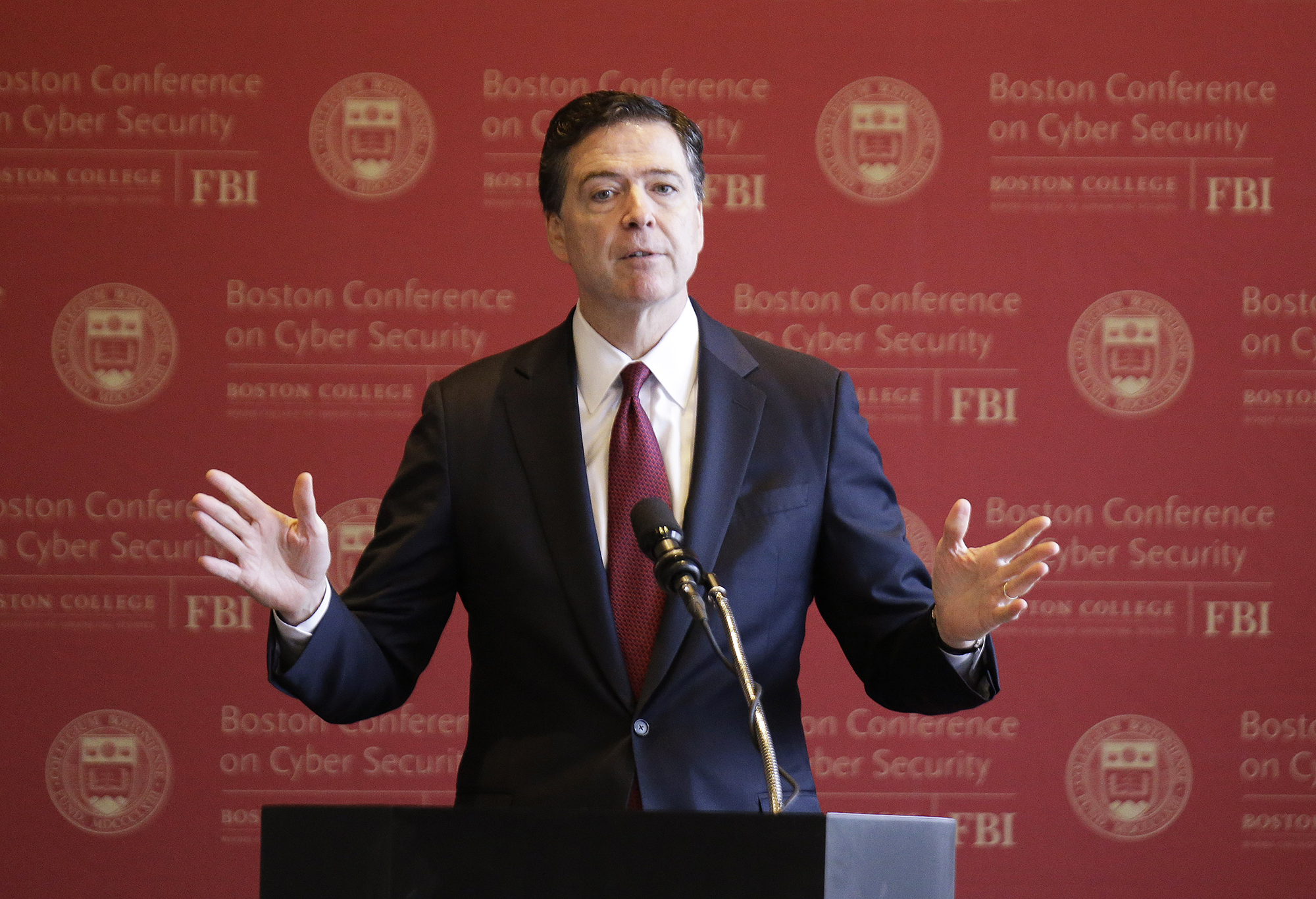 FBI Director James B. Comey gestures as he delivers an address on cyber security at the first Boston Conference of Cyber Security in Boston, on March 8, 2017. (Stephan Savoia—AP)