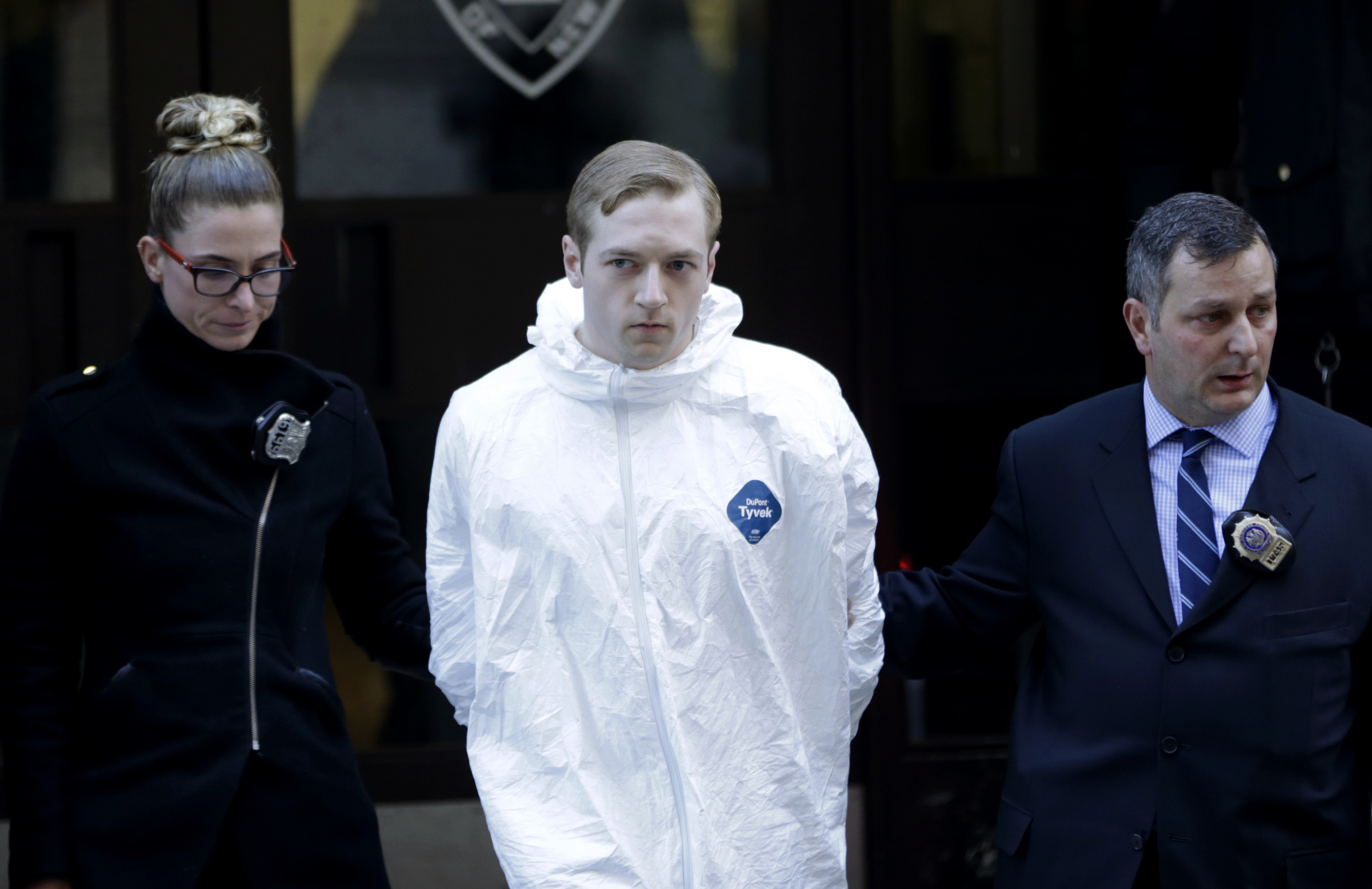 James Harris Jackson is escorted out of a police precinct in New York on March 22, 2017. Police said Jackson, accused of fatally stabbing a black man in New York City, told investigators he traveled from Baltimore specifically to attack black people. (Seth Wenig&mdash;AP)