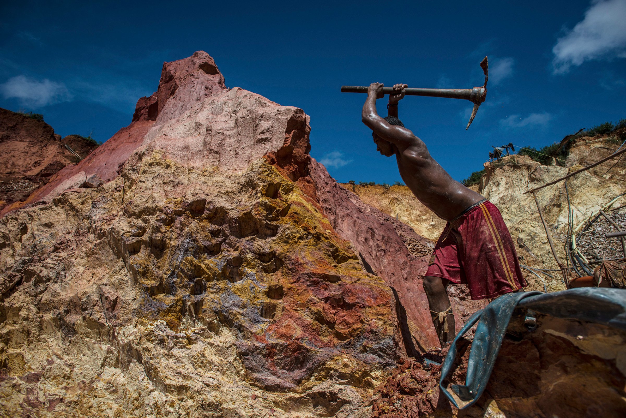 Carlos Freydel mines for gold at the illegal "Cuatro Muertos" mine outside Las Claritas, Venezuela, on July 20, 2016. The cratered economy has sent many Venezuelans to work in the country's illegal gold mines scattered across the jungle, where the primitive conditions have seen malaria return with a vengeance.