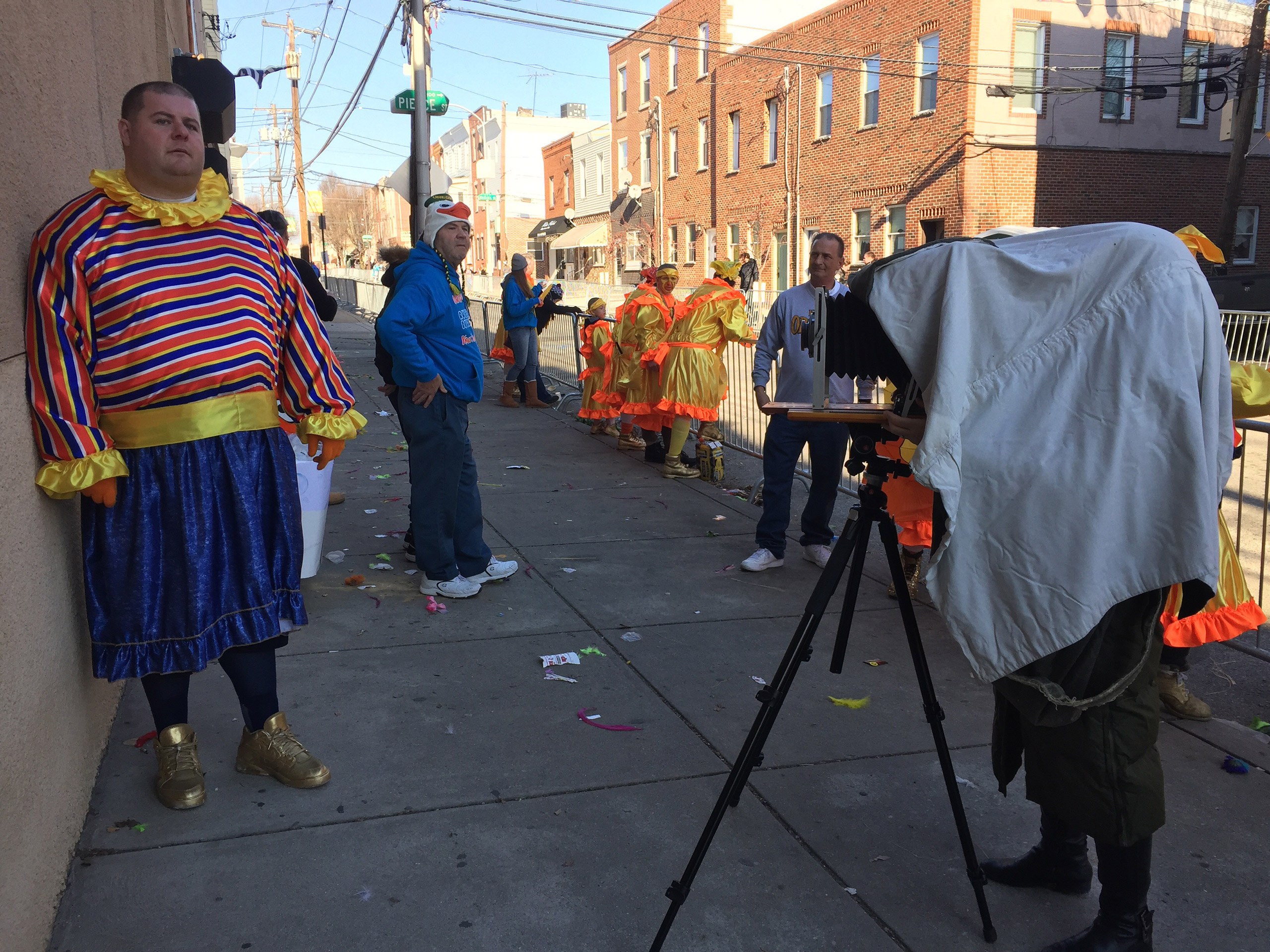 Andrea Modica photographs a member of the Wenche brigade during the annual Mummers parade. (Mike Arrison)