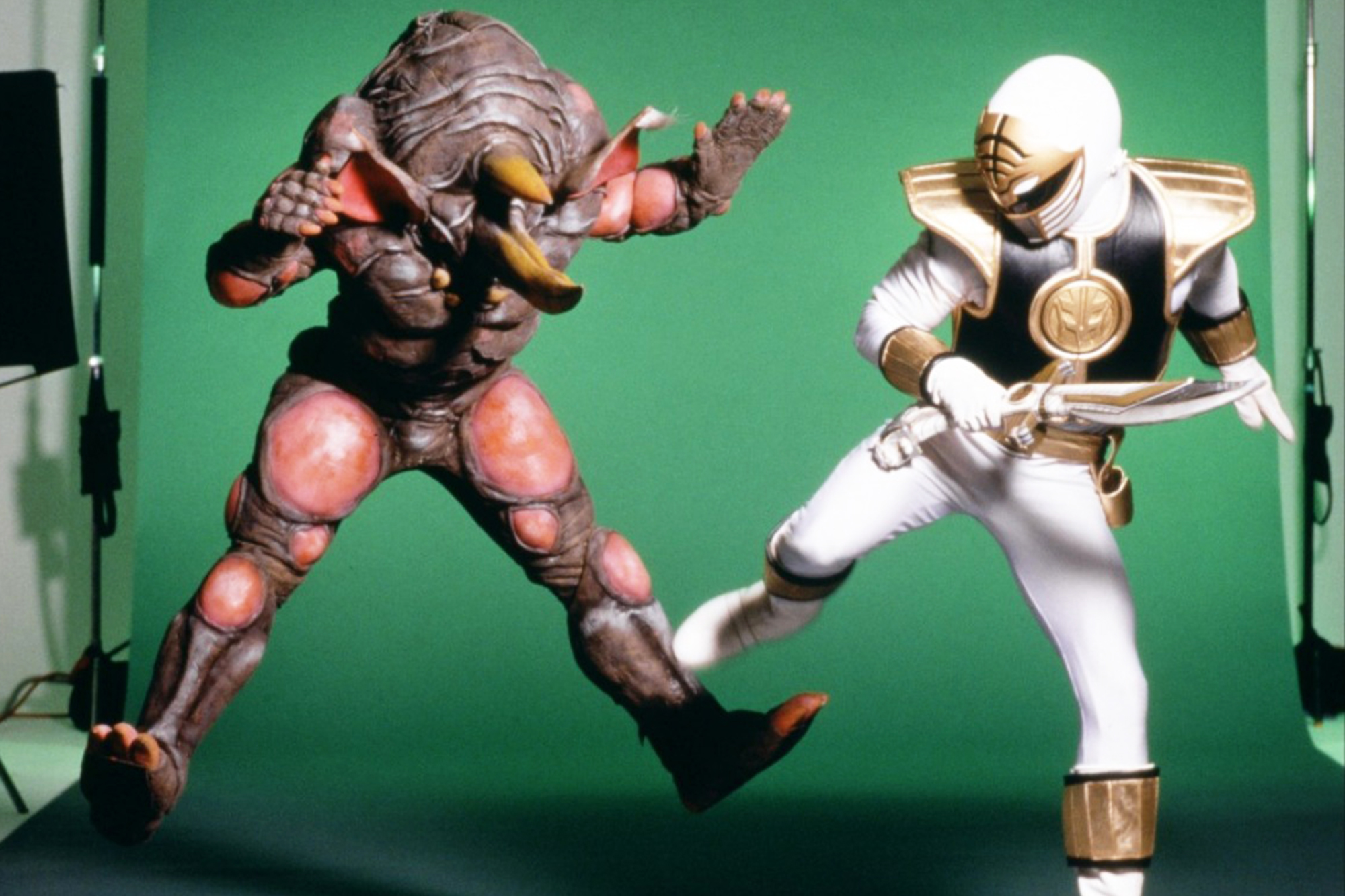 An unidentified actor as Rhinoblaster and Jason David Frank as the White Ninja Ranger.