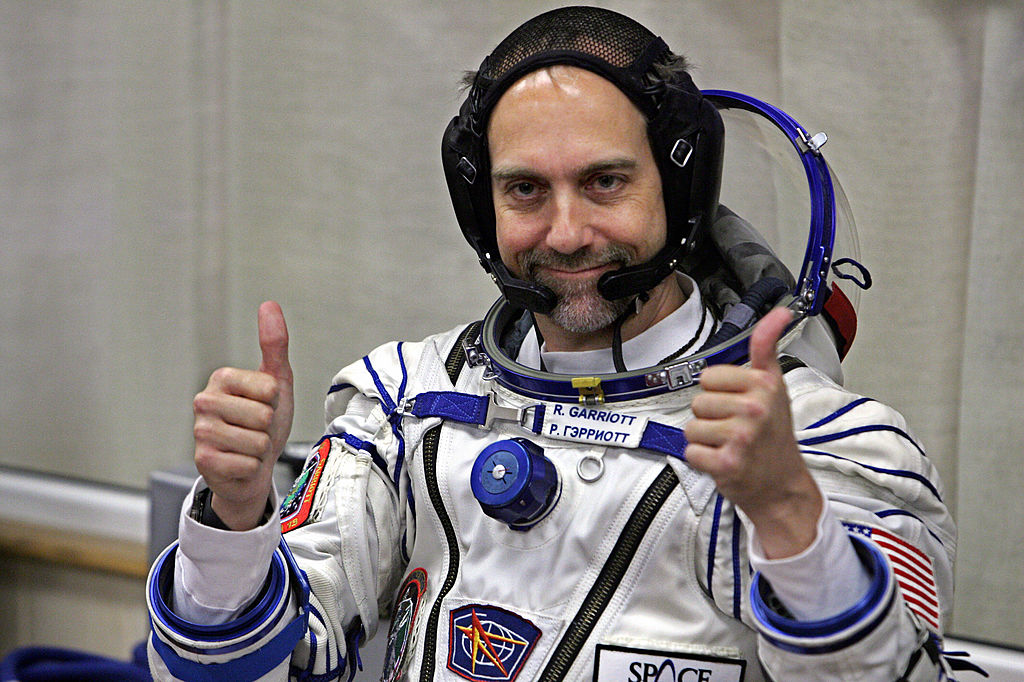 U.S. space tourist Richard Garriott gestures after putting on a space suit at the Baikonur cosmodrome, in Kazakhstan, on Oct. 12, 2008.