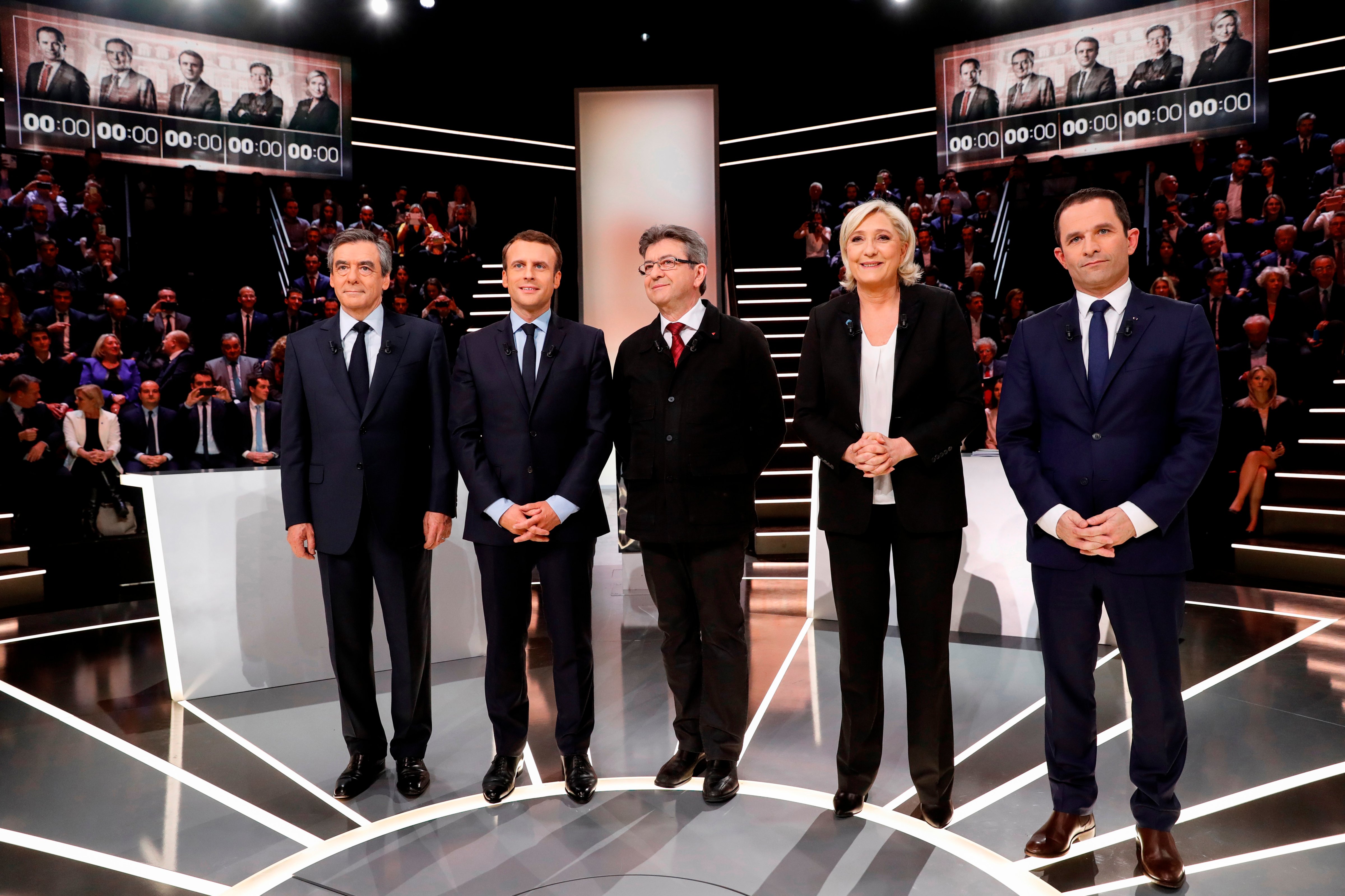 French presidential election candidates (LtoR) Francois Fillon, Emmanuel Macron, Jean-Luc Melenchon, Marine Le Pen and Benoit Hamon, pose before a debate organised by French private TV channel TF1 in Aubervilliers