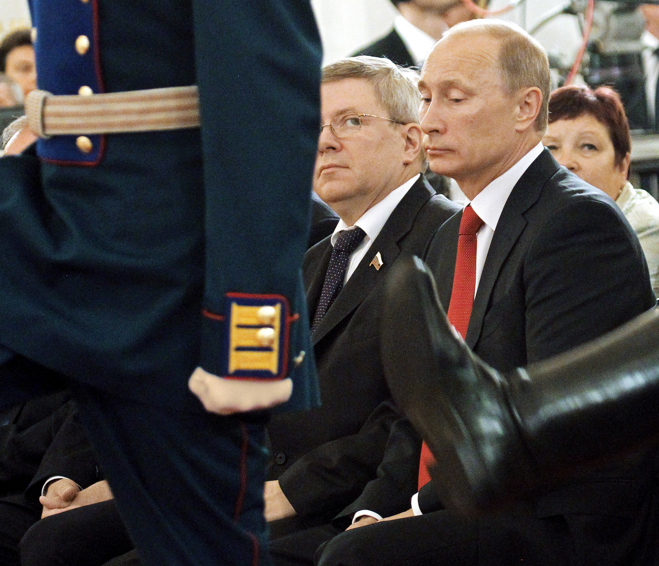 Former Russian senator Alexander Torshin, center, with Vladimir Putin at a Kremlin ceremony in 2011 (Konstantin Zavrazhin—Getty Images)