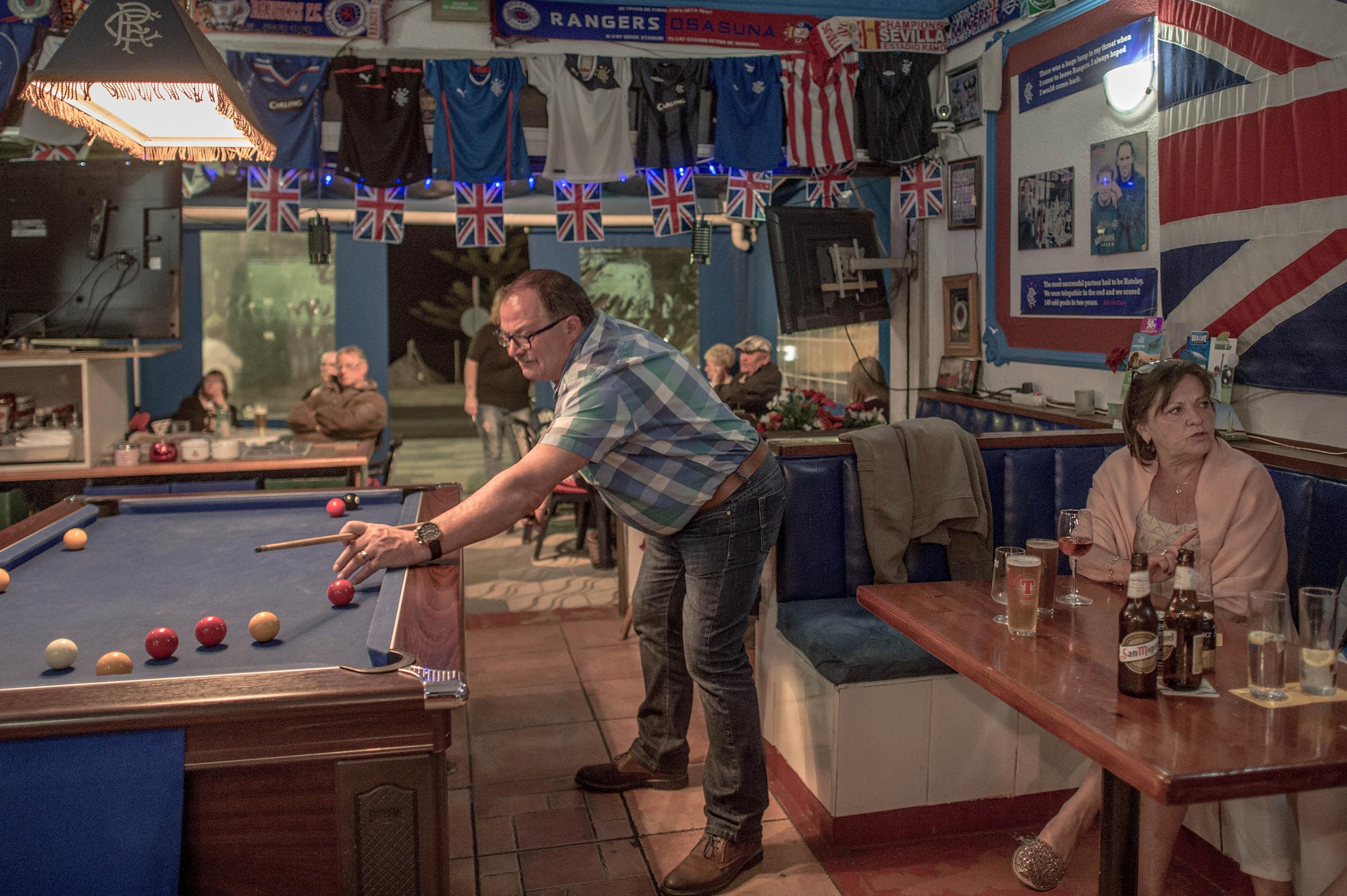 British tourists play pool at a English bar in Benalmadena, Spain, on March 17, 2016. Spain is Europe's top destination for British expats.