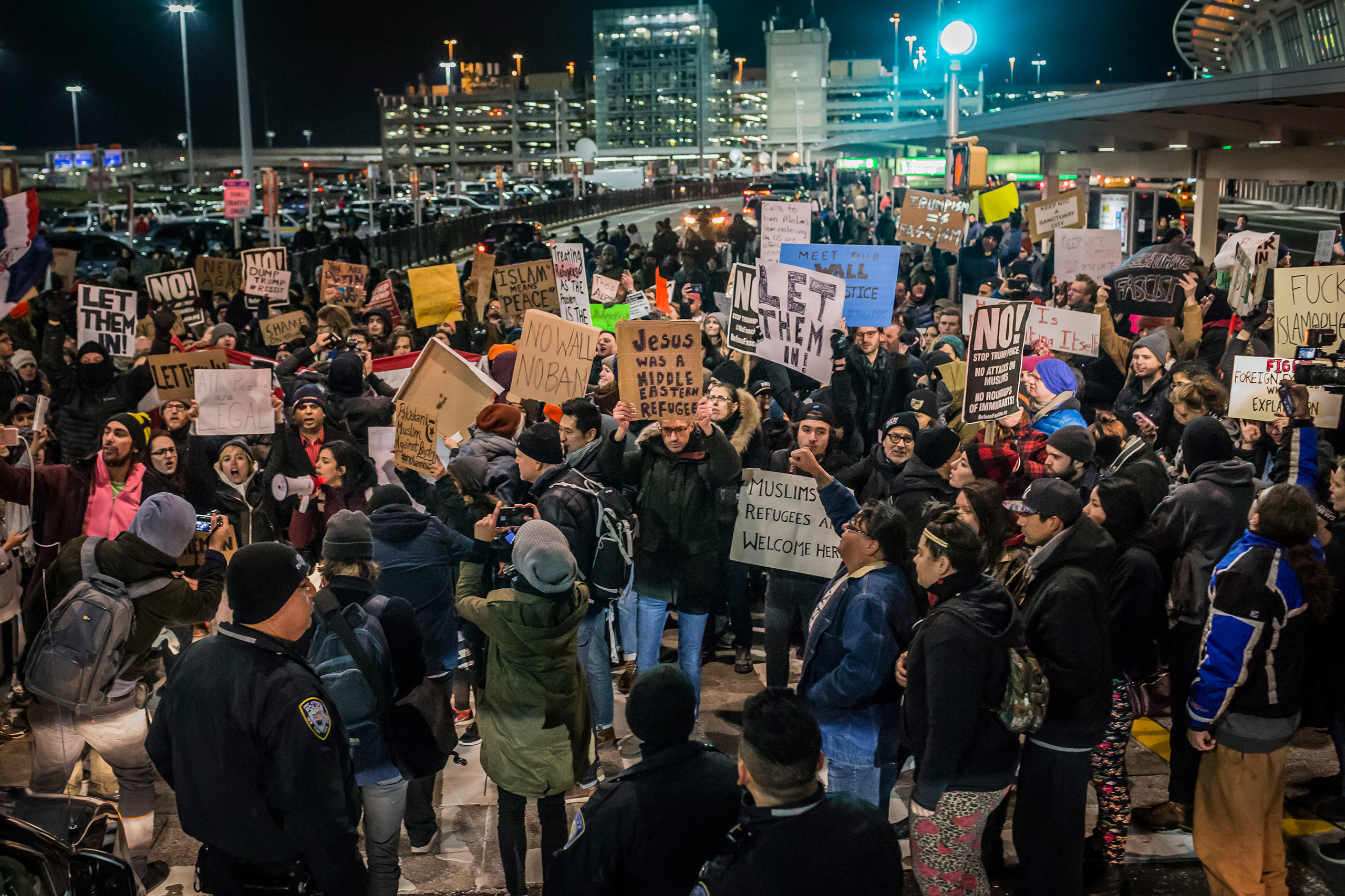 For over 8 hours on Jan. 28, 2017, thousands flooded into Terminal 4 at New York's John F. Kennedy International Airport, at times shutting down the hub while protesting Donald Trump's executive order banning Muslims from certain countries from traveling to the U.S. Around 8 p.m. that evening, the federal court for the Eastern District of New York issued an emergency stay halting the ban. (Michael Nigro—Pacific Press/LightRocket/Getty Images)