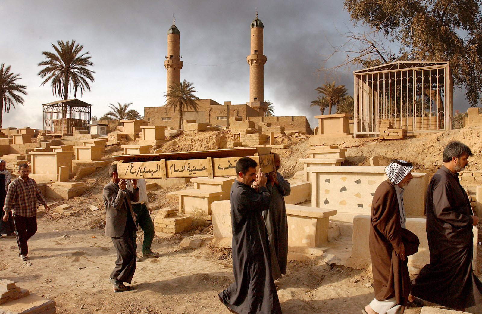 Mourners at a cemetery, Baghdad, Iraq, April 2, 2003.