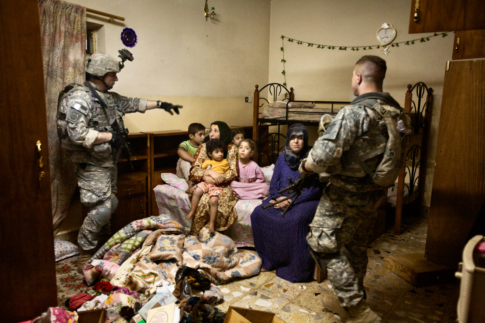 U.S. soldiers raid a home where they arrested two al Qaeda supporters in Samarra, Iraq, Sept, 28, 2007. This is the last mission for the 'Smash Platoon' before returning to the U.S.