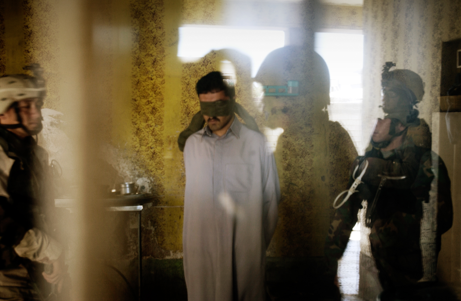 Soldiers of the 1st Battalion search house to house for insurgents in the Mula'ab disctrict in Ramadi, an insurgent stronghold west of Baghdad, Iraq, March 05, 2005.