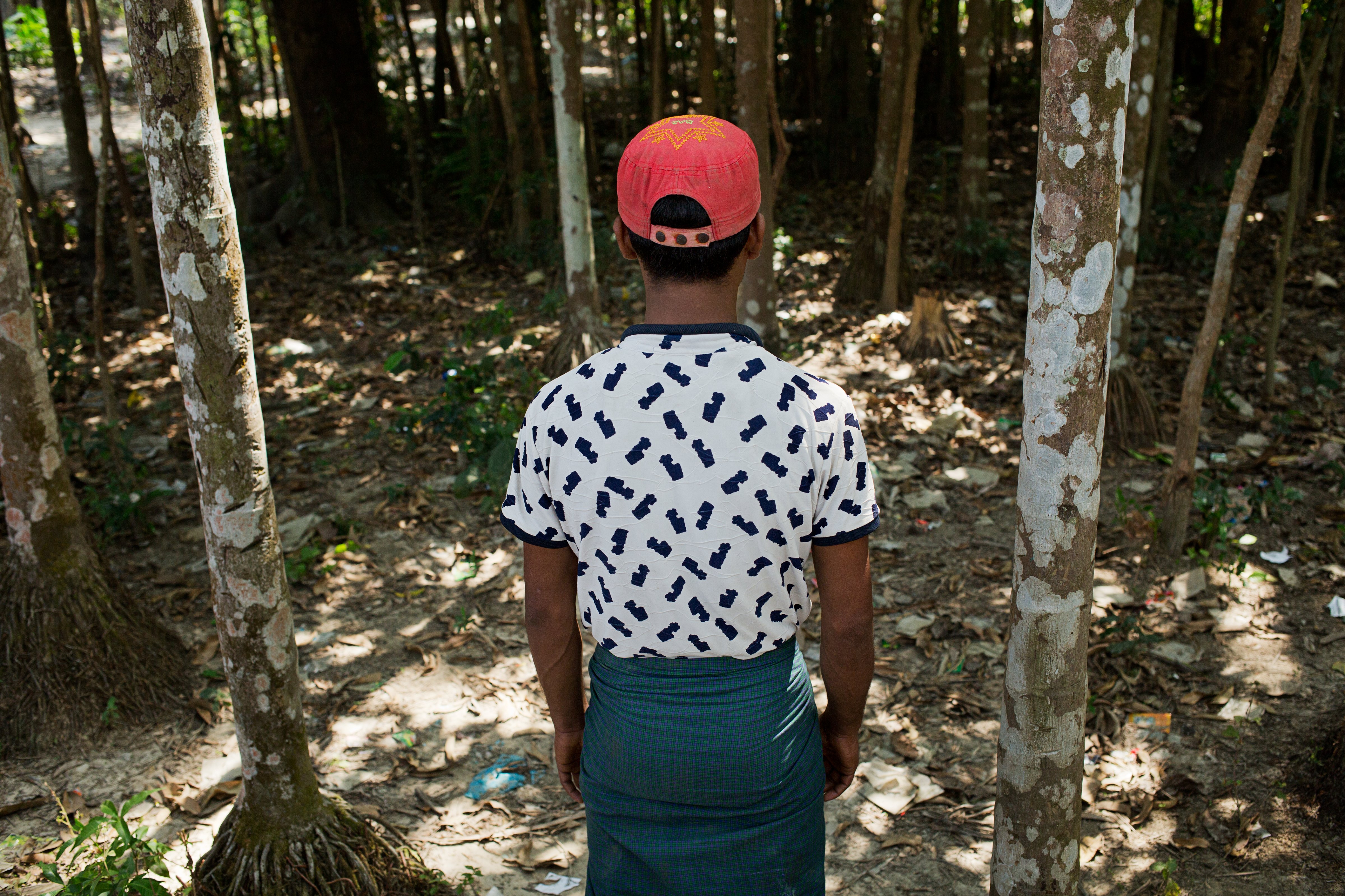 Ahmed Mahmood looks at the spot in Myo Thu Gyi village, in Myanmar's Rakhine state, where he saw the Myanmar Border Guard Police executing three villagers, on March 19, 2017 (Antolin Avezuela Aristu)