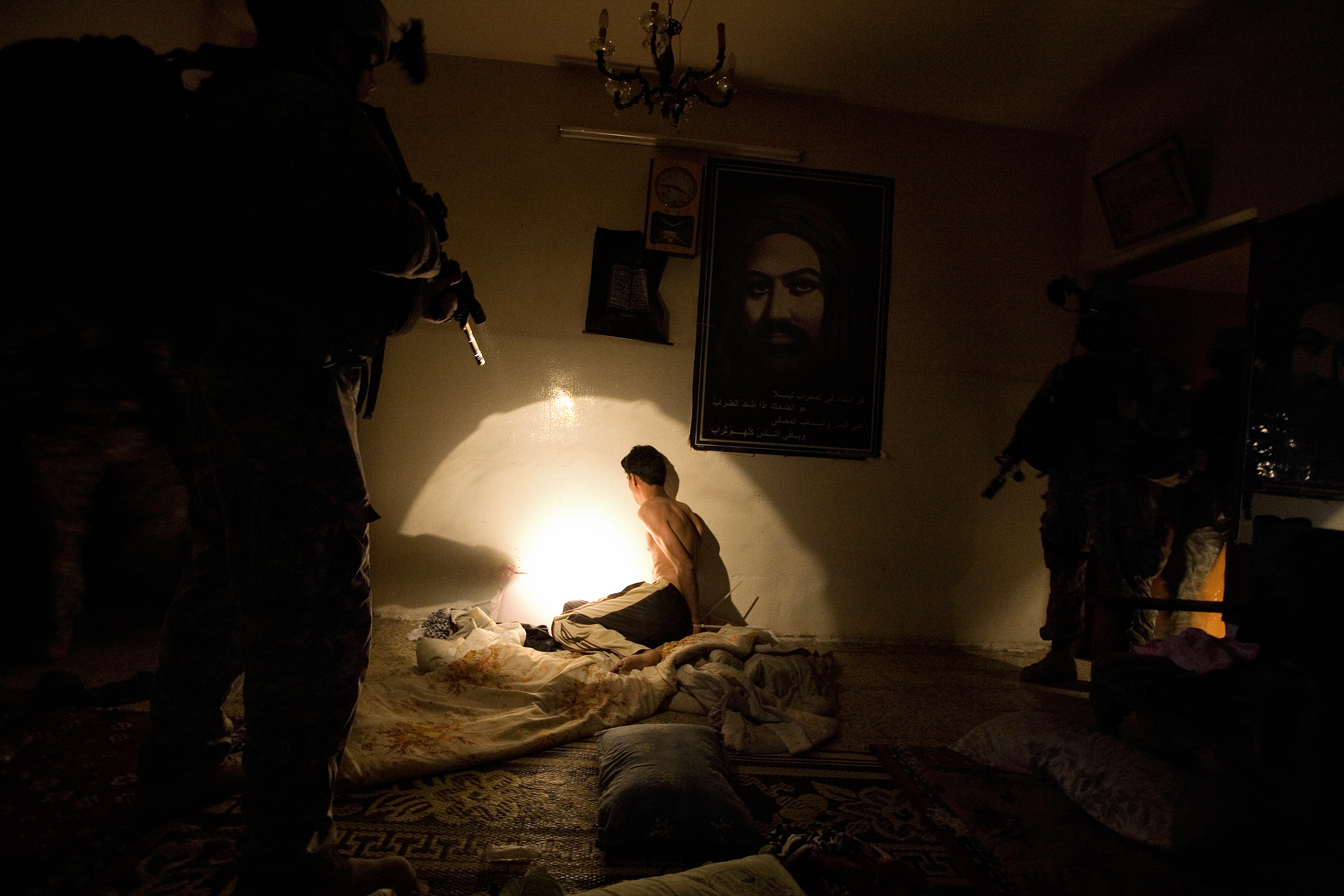 U.S. soldiers arrest a group of suspected Madhi Army members, including this man, in the Shi'te district of Shaab, Baghdad, Iraq, May 28, 2007. The men were accused of kidnapping and killing a Sunni man.