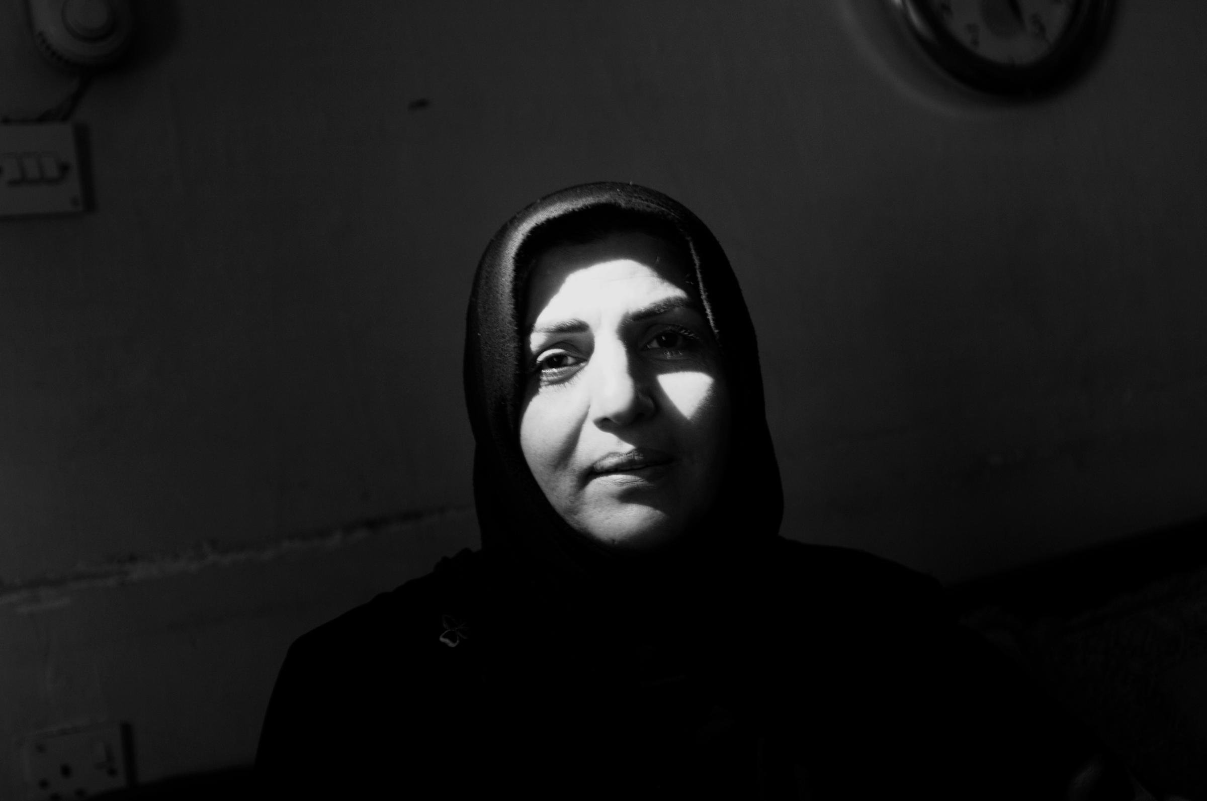 A Shi'ite woman in her home, Baghdad Feb.15, 2007. Where Iraqis of different faiths once mixed and lived next to each other, as the country erupted into civil war, people of different faiths rarely associated with former neighbors.