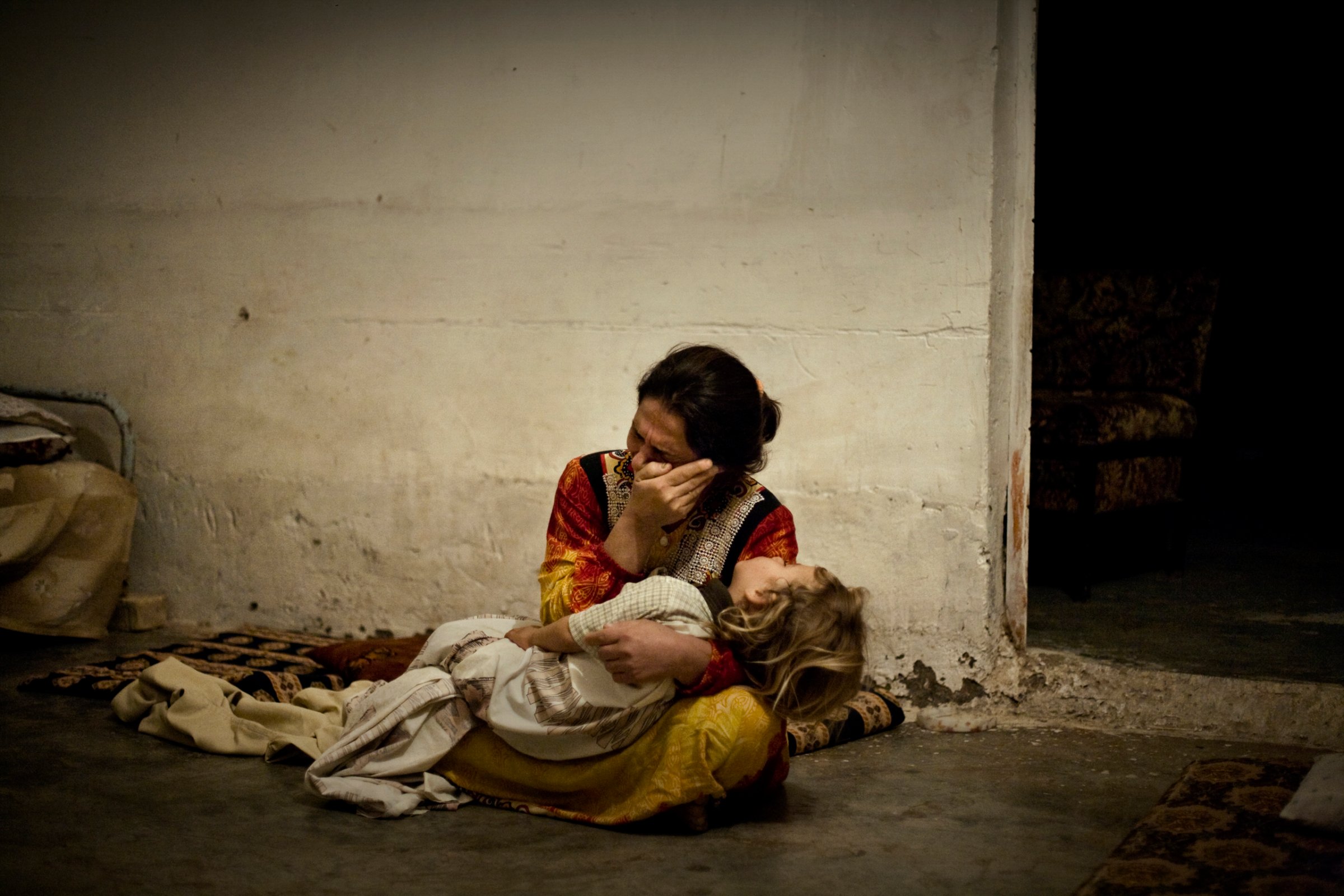 A mother cries for her seriously ill daughter at the local hospital, which was closed after insurgents attacked it, in the al Qaeda stronghold of Muqdadiyah, Diyala province, Iraq, Oct. 3, 2007.