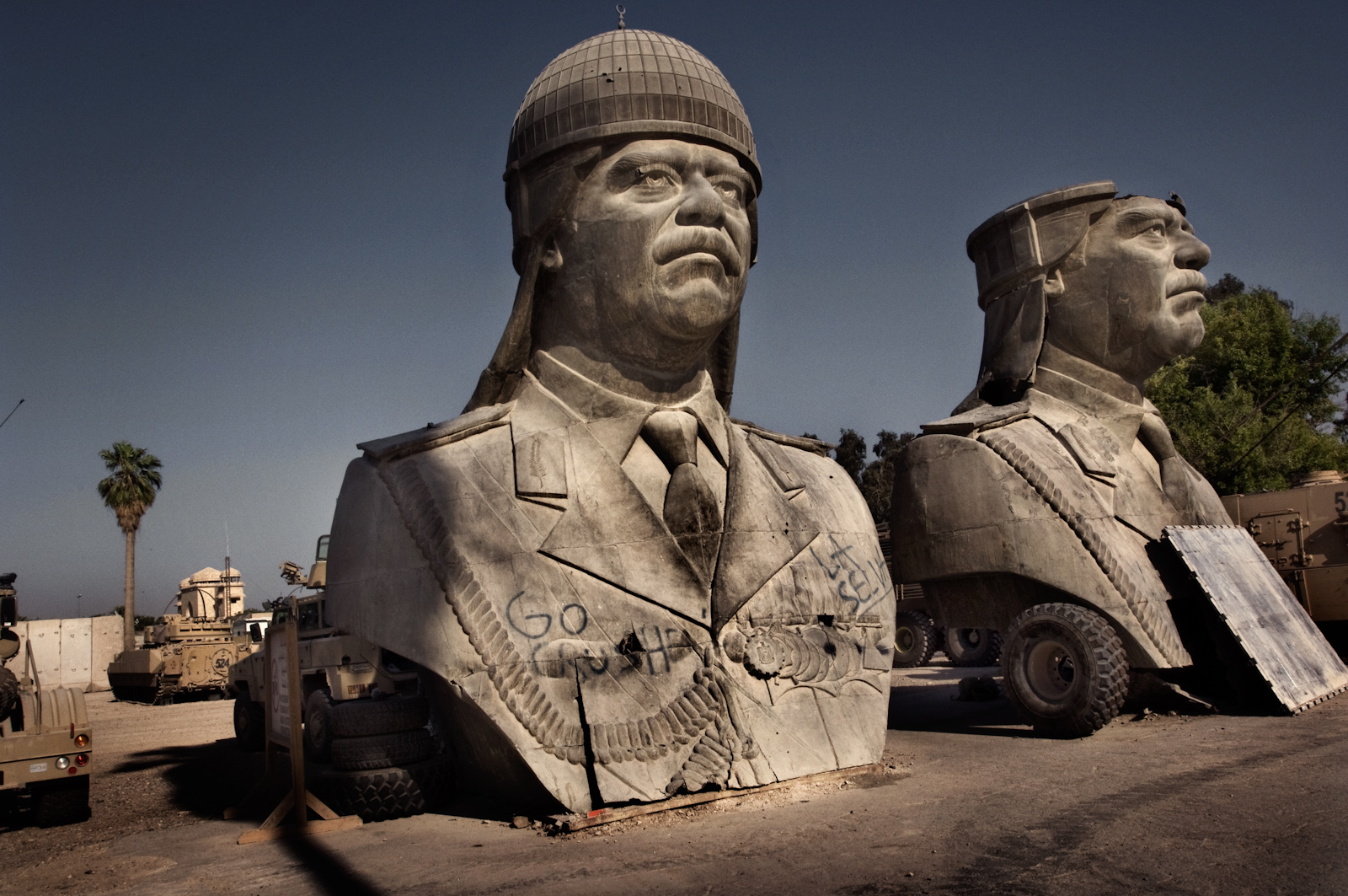 Large bronze heroic statues that once decorated Saddam Hussein's al Salam (peace palace) palace sits in ruins in Baghdad, Iraq, July 13, 2006.