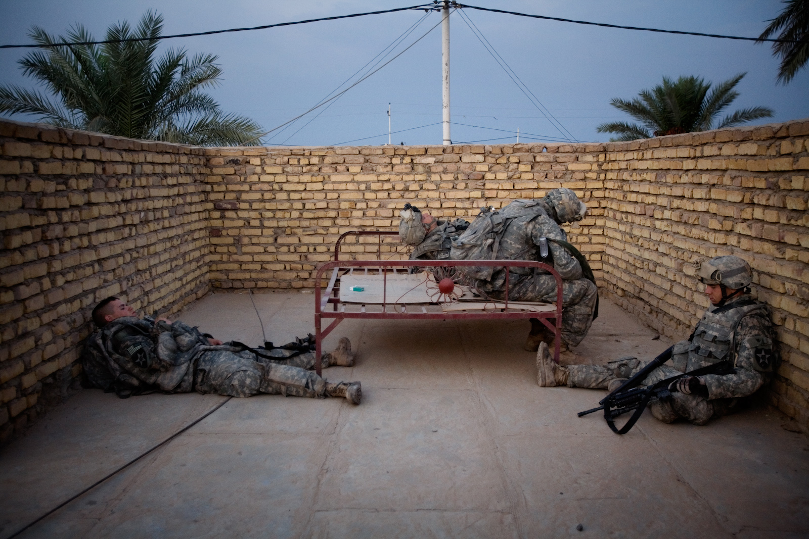 Soldiers from the 2nd Battalion Alpha Company rest between home searches on the outskirts of Muqdadiyah, Diyala province, Iraq, Oct. 6, 2007. The area, approximately 56 miles (90 kilometers) north of Baghdad, is a known as al Qaeda stronghold.