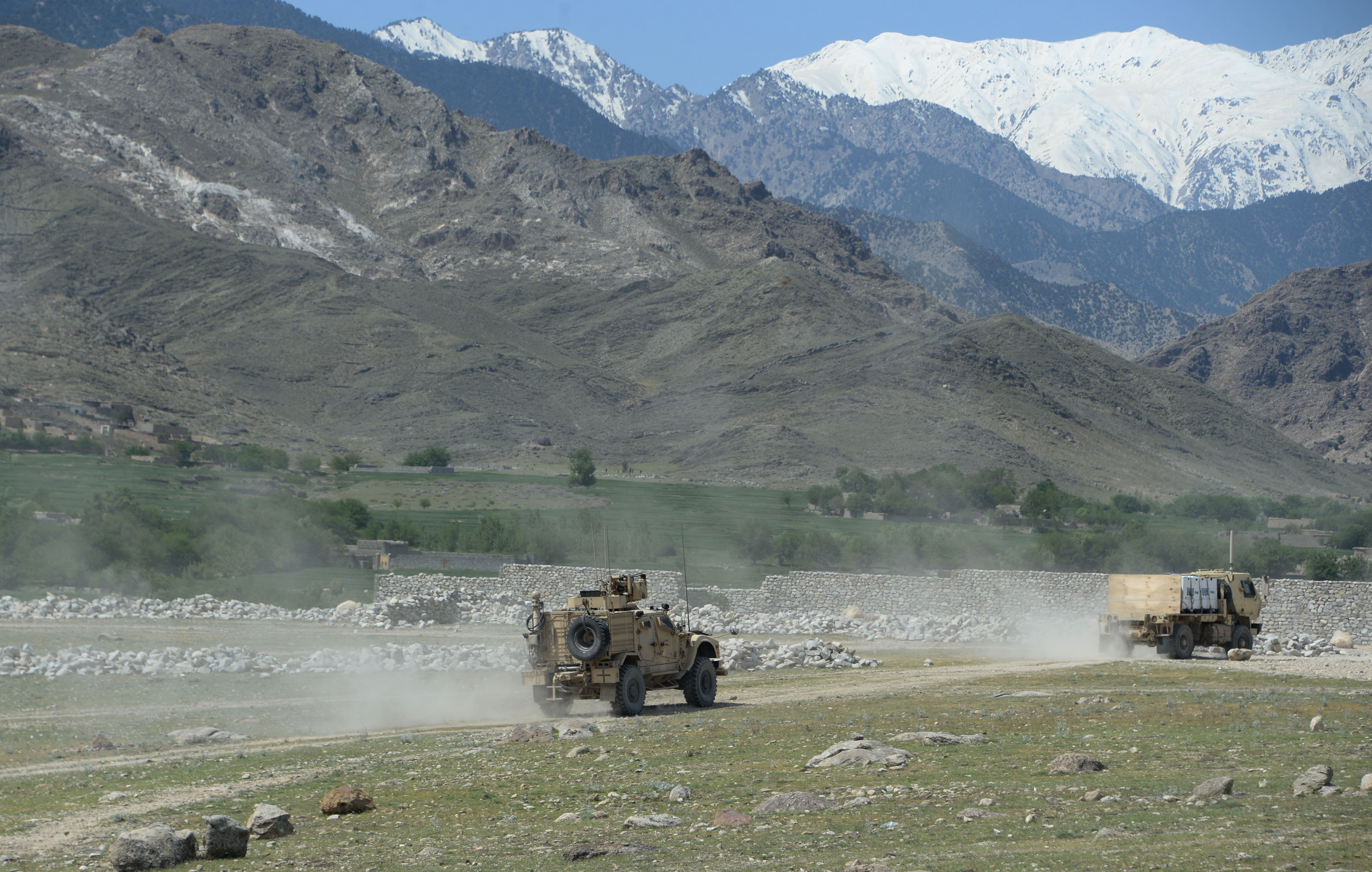 US armoured vehicles patrol near the site of a US bombing during an operation against Islamic State (IS) militants in the Achin district of Nangarhar province on April 15, 2017. (NOORULLAH SHIRZADA&mdash;AFP/Getty Images)